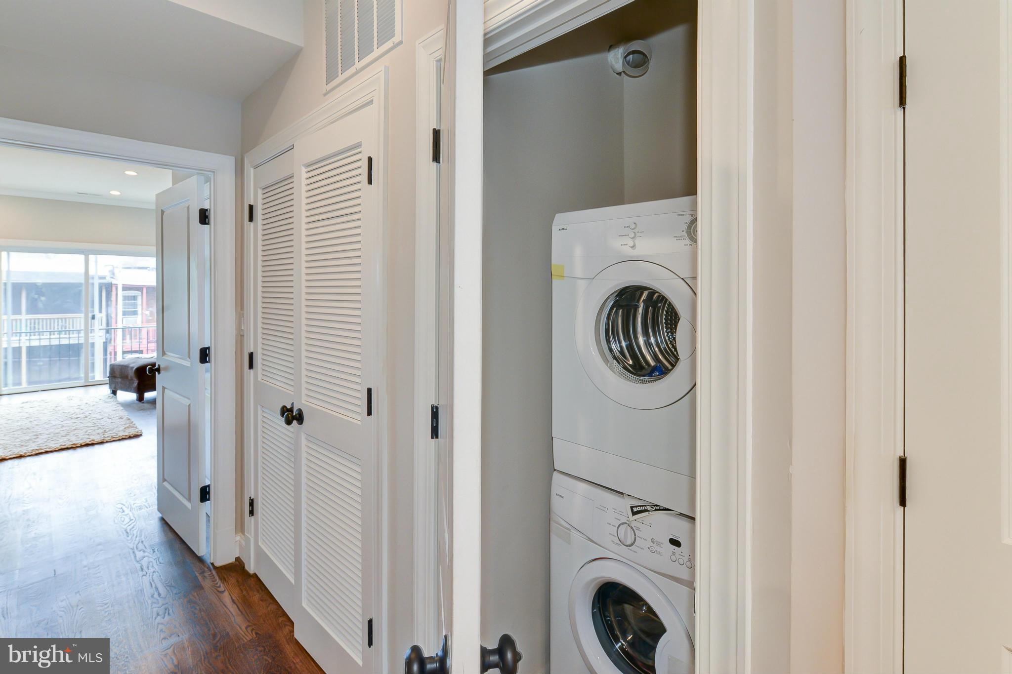 39 U Street Northeast, Unit 1 Washington, DC 20002 - Photo 22 of 27 a view of a hallway with washer and dryer