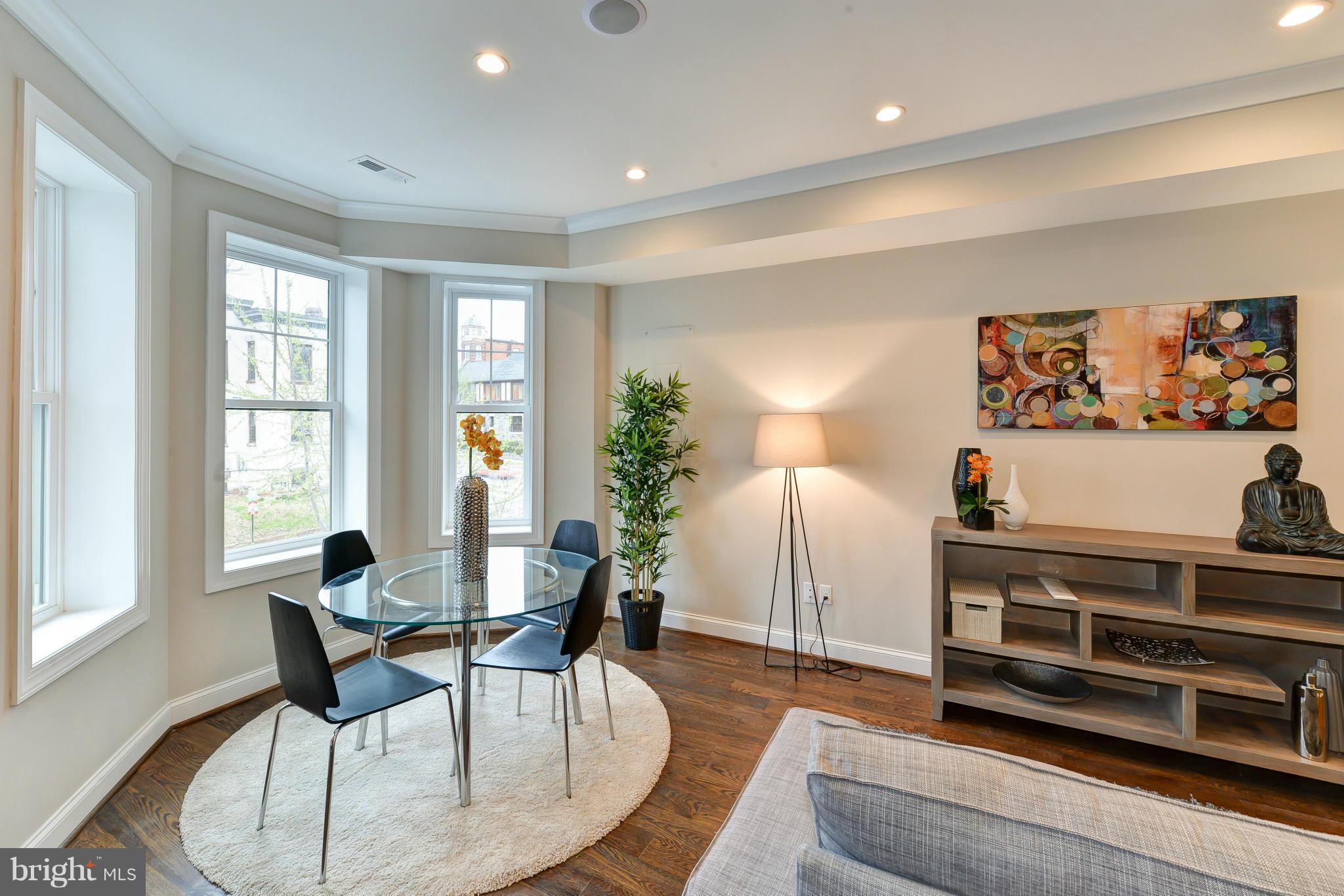 39 U Street Northeast, Unit 1 Washington, DC 20002 - Photo 4 of 27 a living room with furniture and a flat screen tv