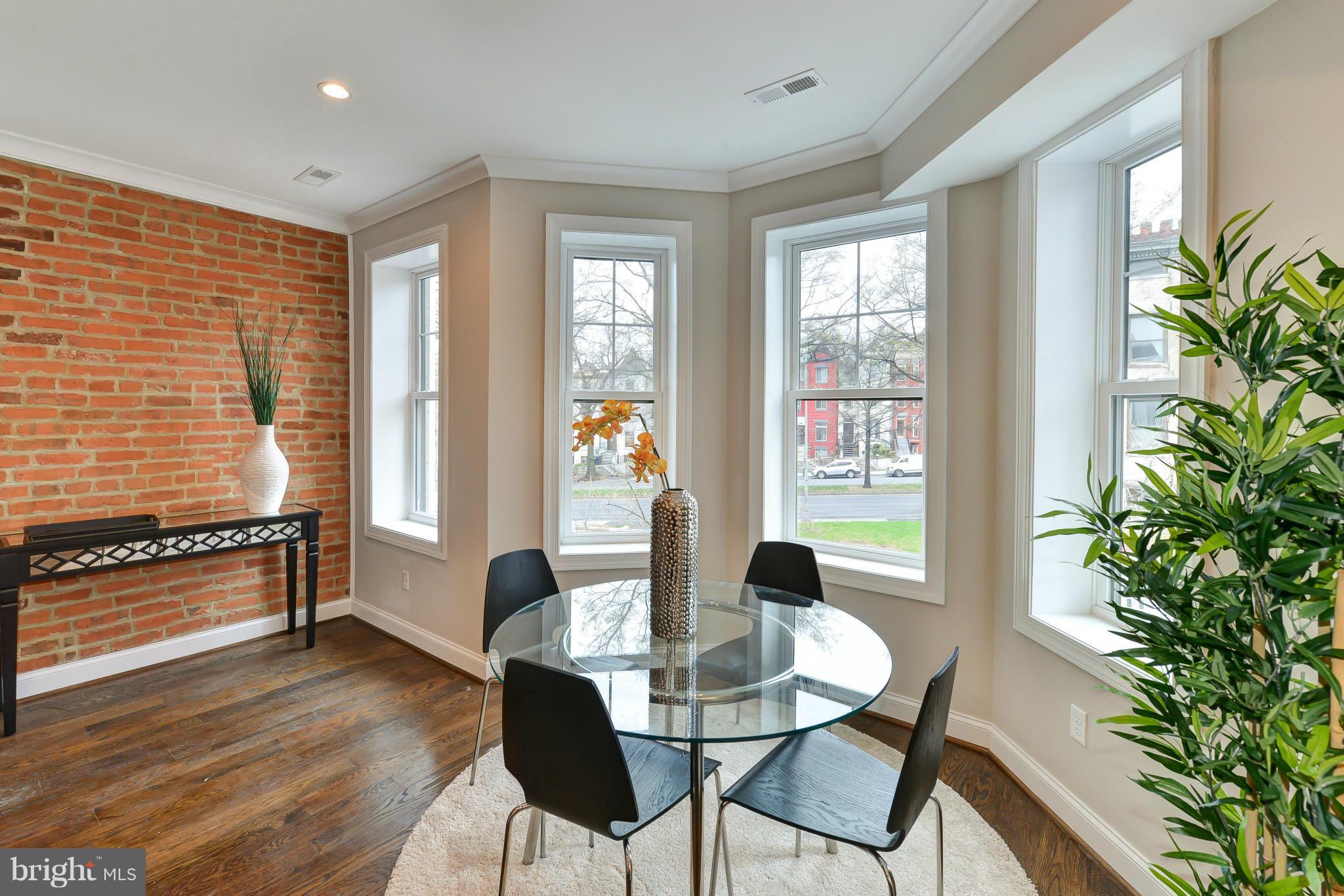 39 U Street Northeast, Unit 1 Washington, DC 20002 - Photo 5 of 27 a view of a dining room with furniture window and wooden floor
