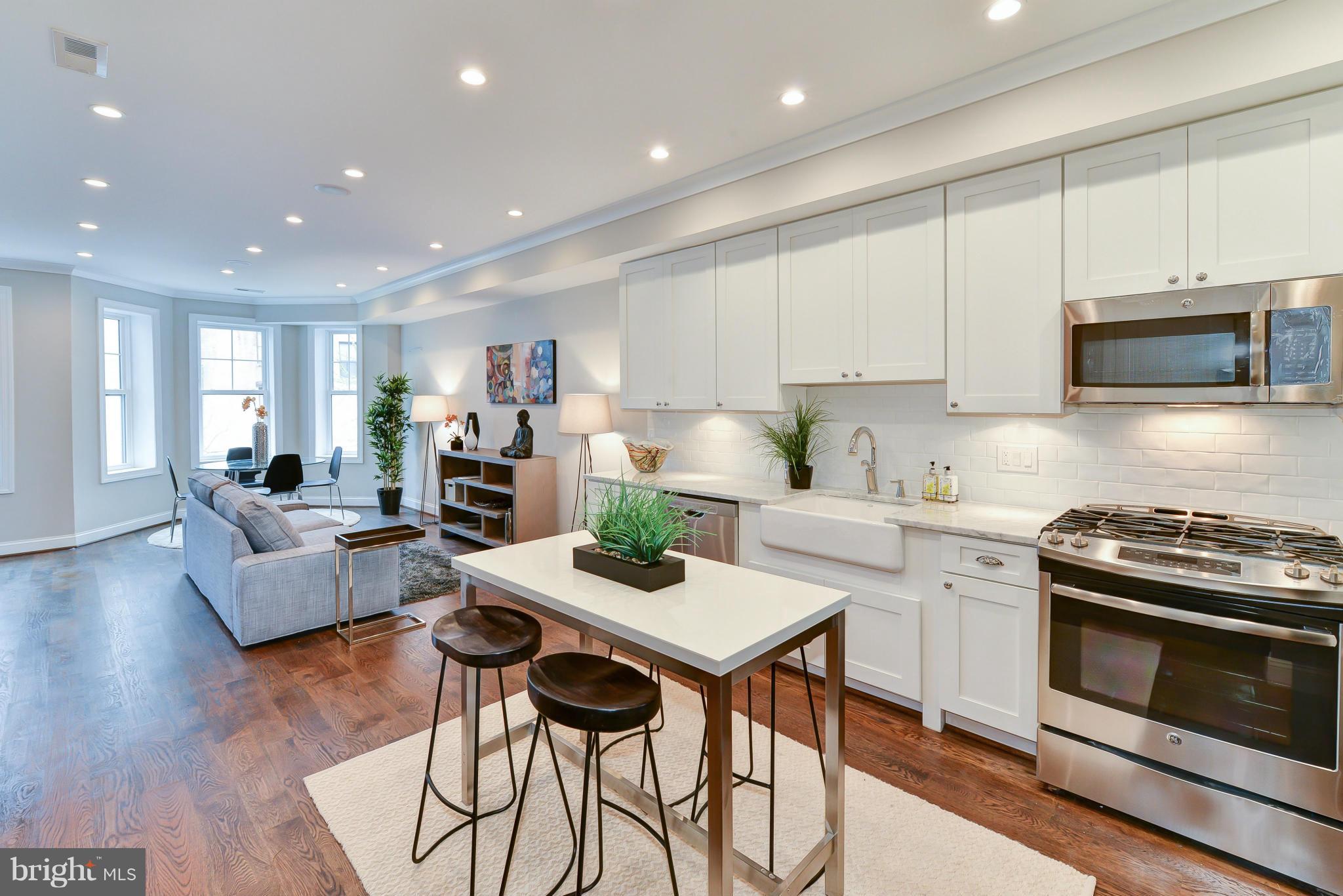 39 U Street Northeast, Unit 1 Washington, DC 20002 - Photo 7 of 27 a kitchen with a table and chairs in it
