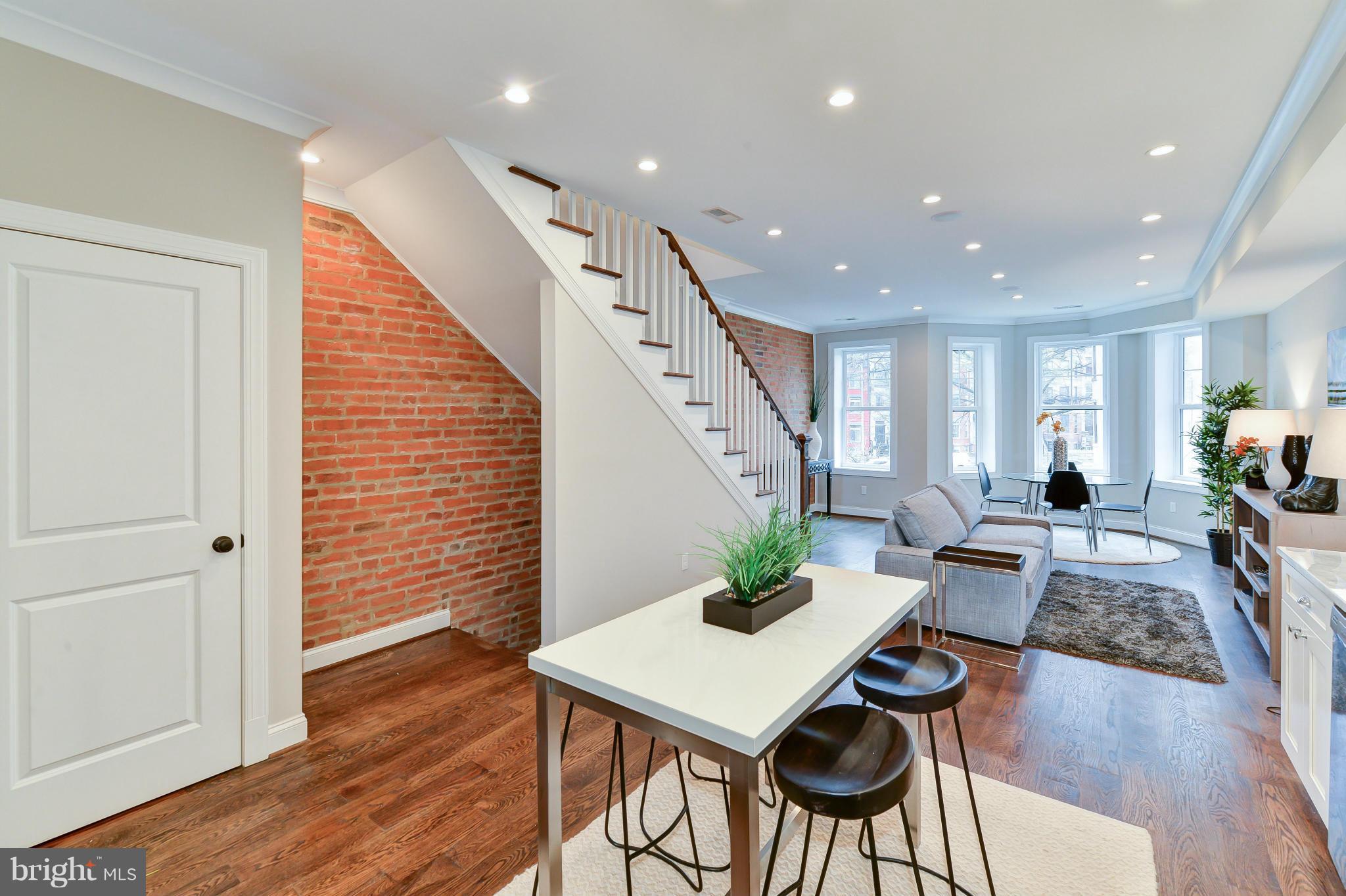39 U Street Northeast, Unit 1 Washington, DC 20002 - Photo 8 of 27 a living room with furniture and wooden floor