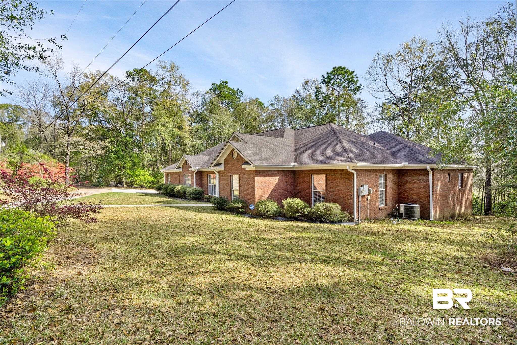 2400 Waterford Road Semmes, AL 36575 - Photo 30 of 30 View of side of home featuring a lawn and brick siding
