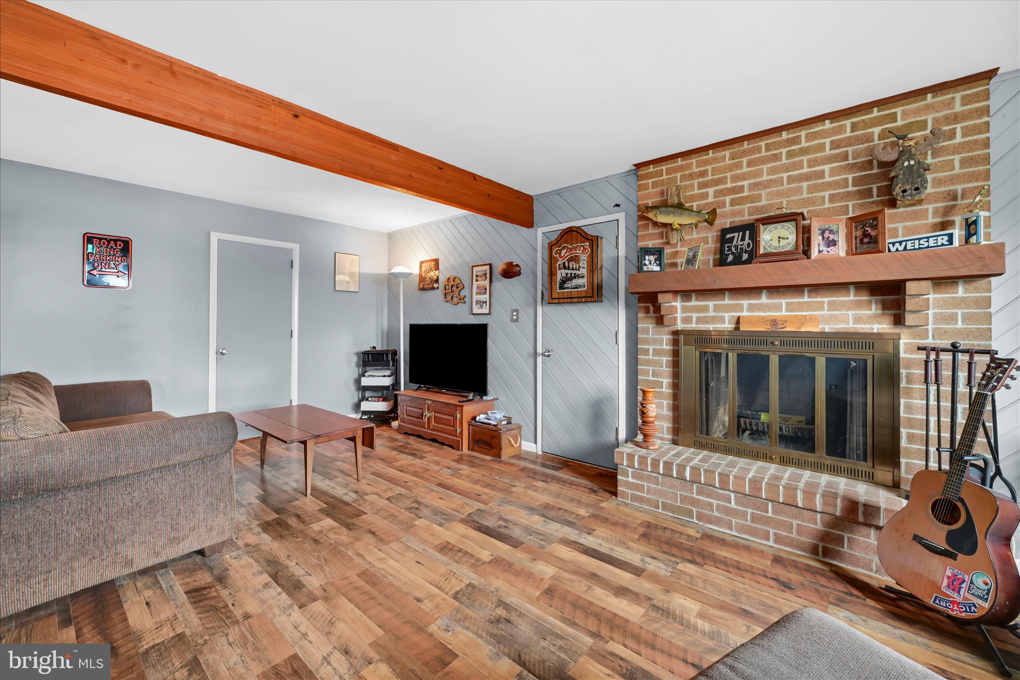 205 Pembroke Drive Reading, PA 19607 - Photo 16 of 40 a living room with furniture a flat screen tv and a fireplace