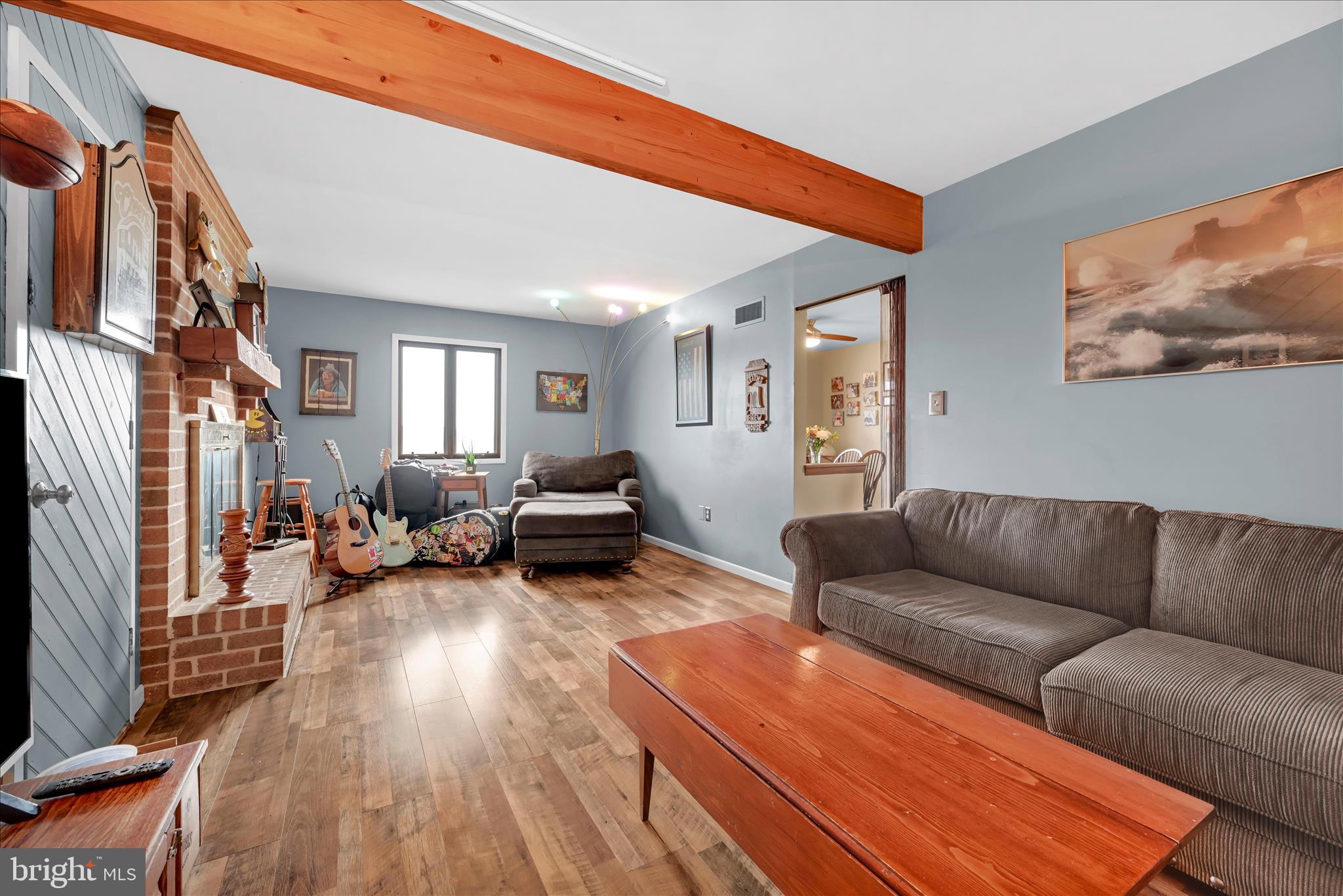 205 Pembroke Drive Reading, PA 19607 - Photo 17 of 40 a living room with furniture a couch and a flat screen tv