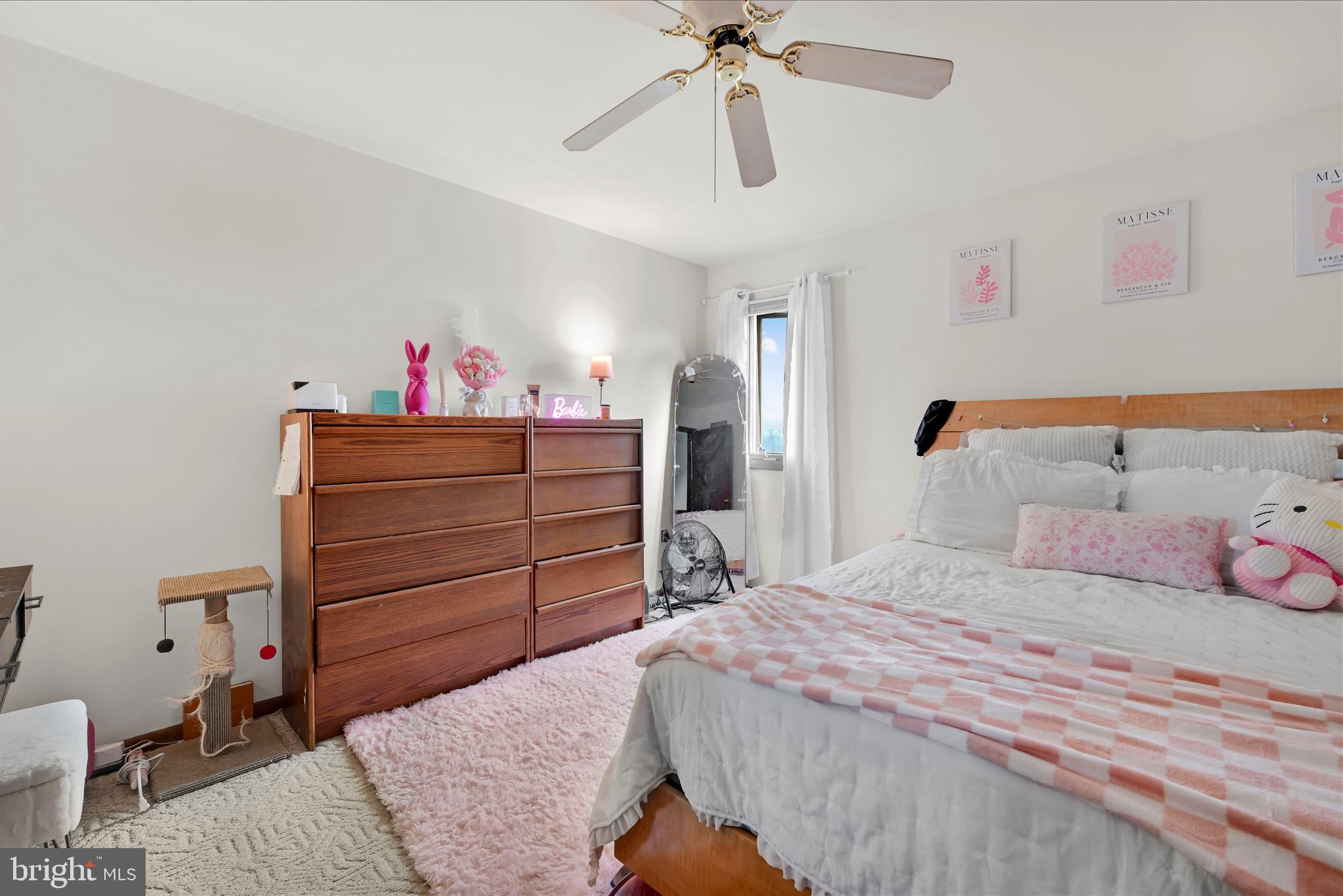 205 Pembroke Drive Reading, PA 19607 - Photo 18 of 40 a bedroom with a bed and a chandelier