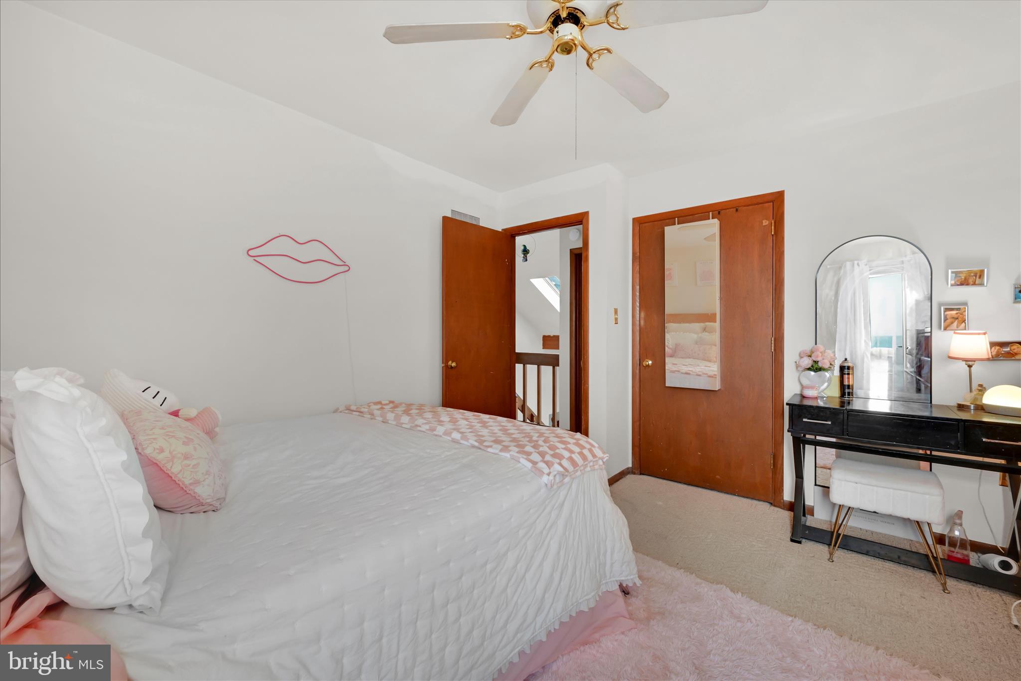 205 Pembroke Drive Reading, PA 19607 - Photo 19 of 40 a bedroom with a bed and a chandelier