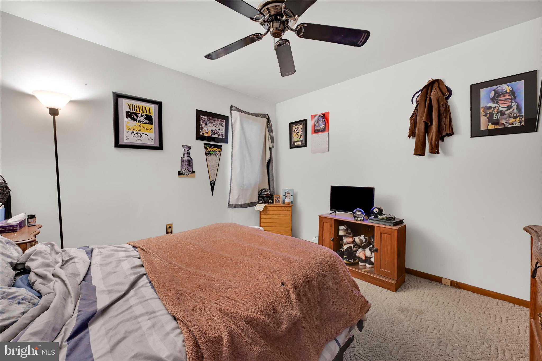 205 Pembroke Drive Reading, PA 19607 - Photo 21 of 40 a bedroom with a bed and a flat screen tv