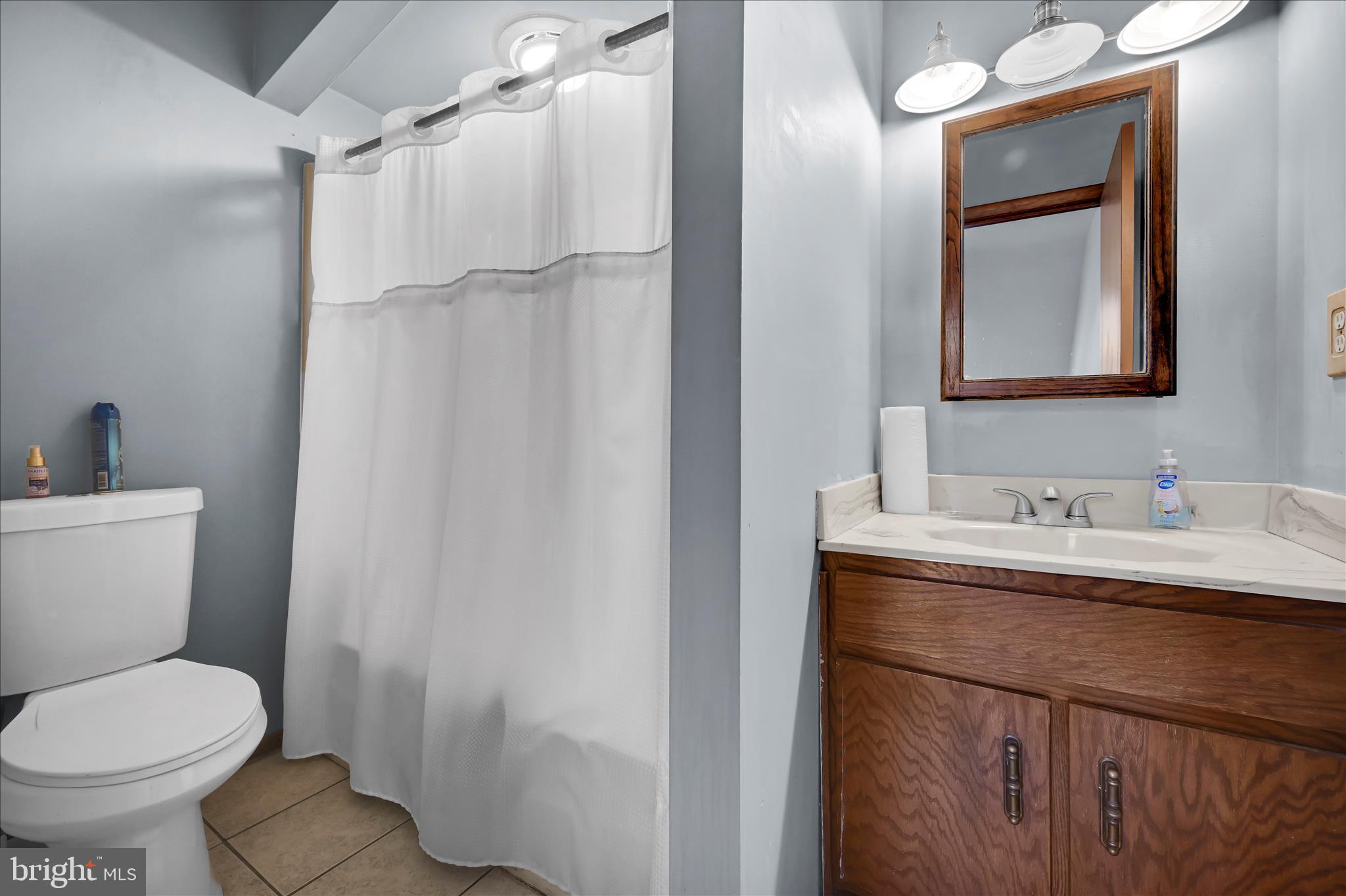 205 Pembroke Drive Reading, PA 19607 - Photo 23 of 40 a bathroom with a granite countertop sink toilet and shower