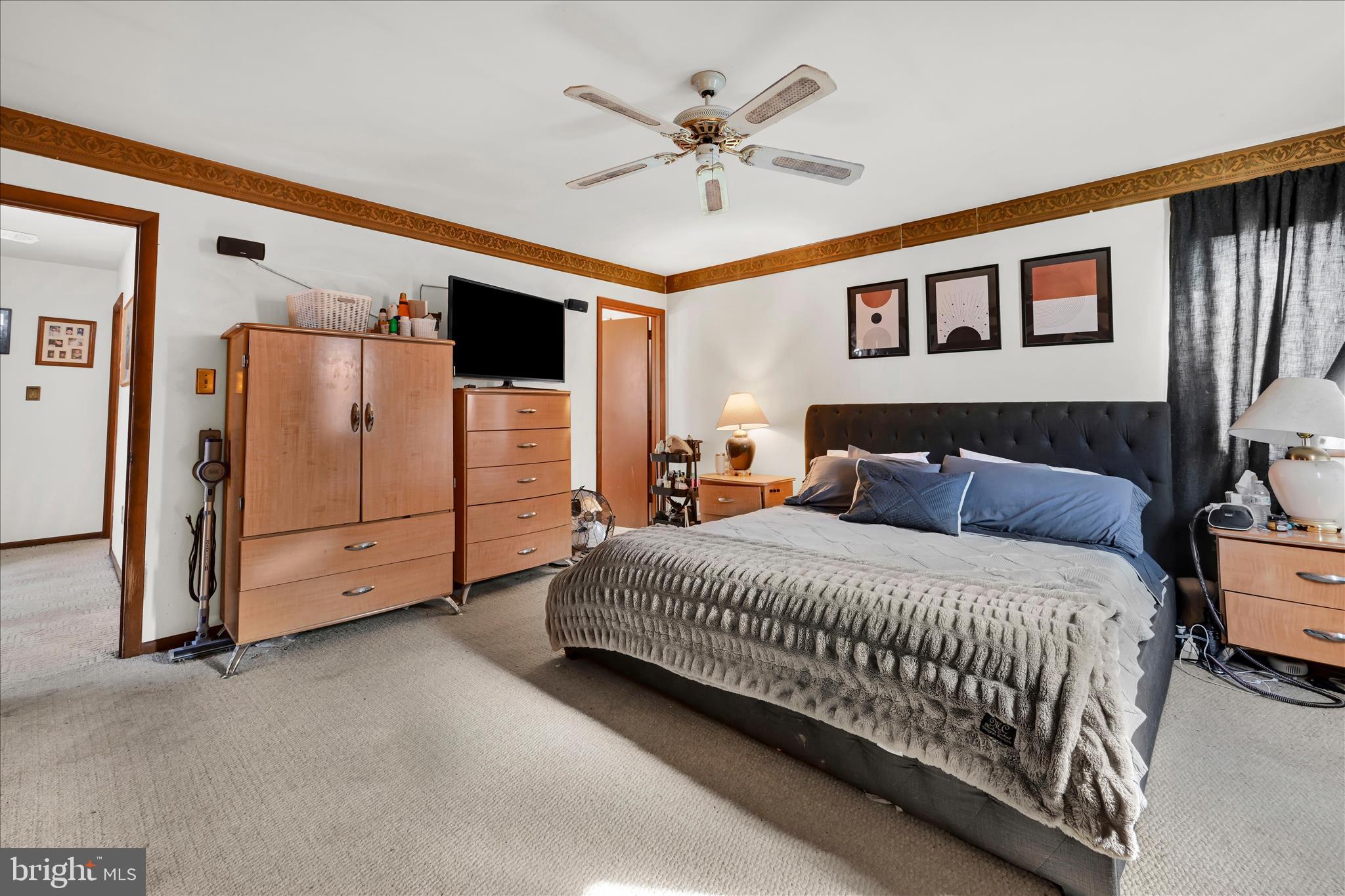 205 Pembroke Drive Reading, PA 19607 - Photo 26 of 40 a spacious bedroom with a bed and a ceiling fan