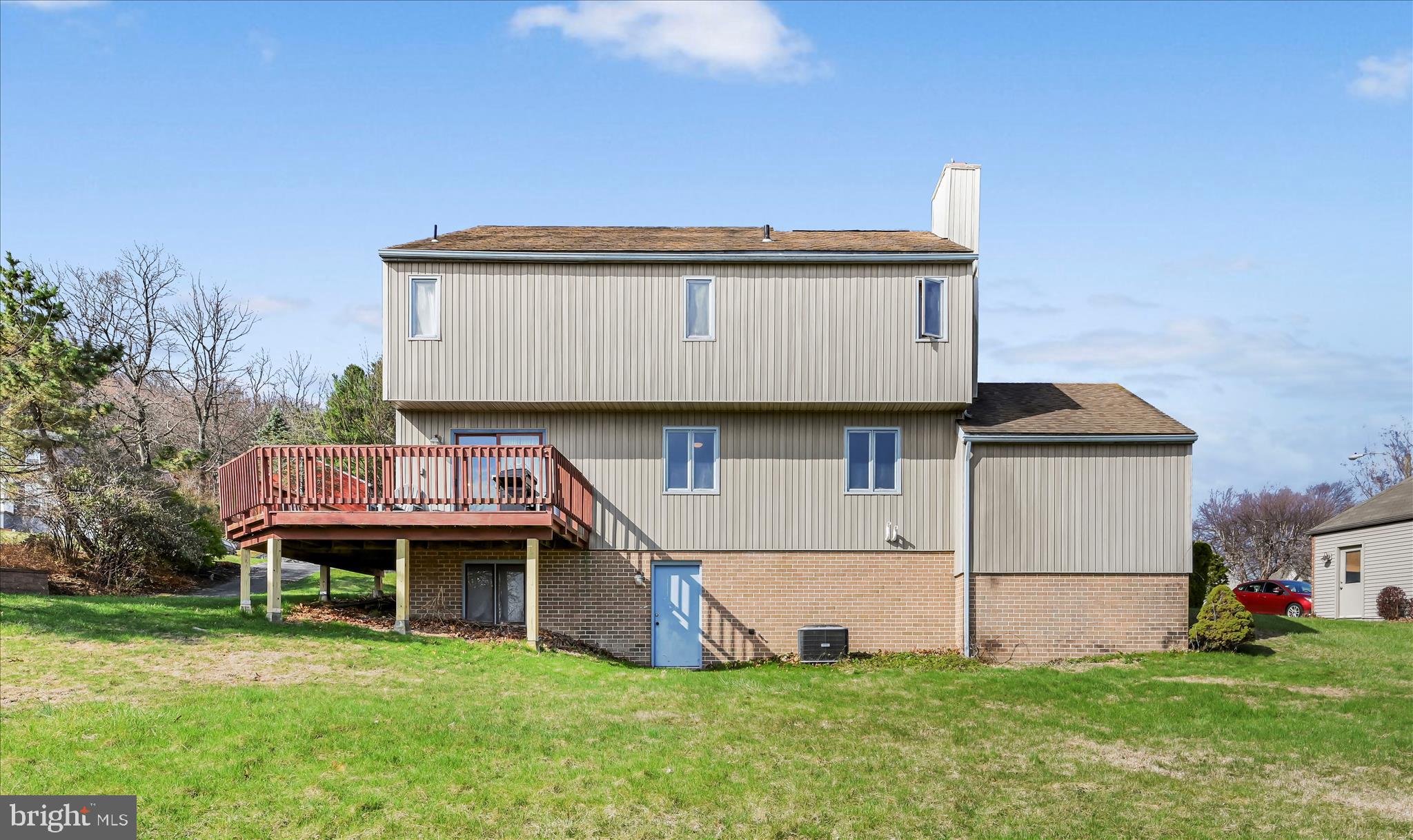 205 Pembroke Drive Reading, PA 19607 - Photo 29 of 40 a front view of a house with a yard and garage