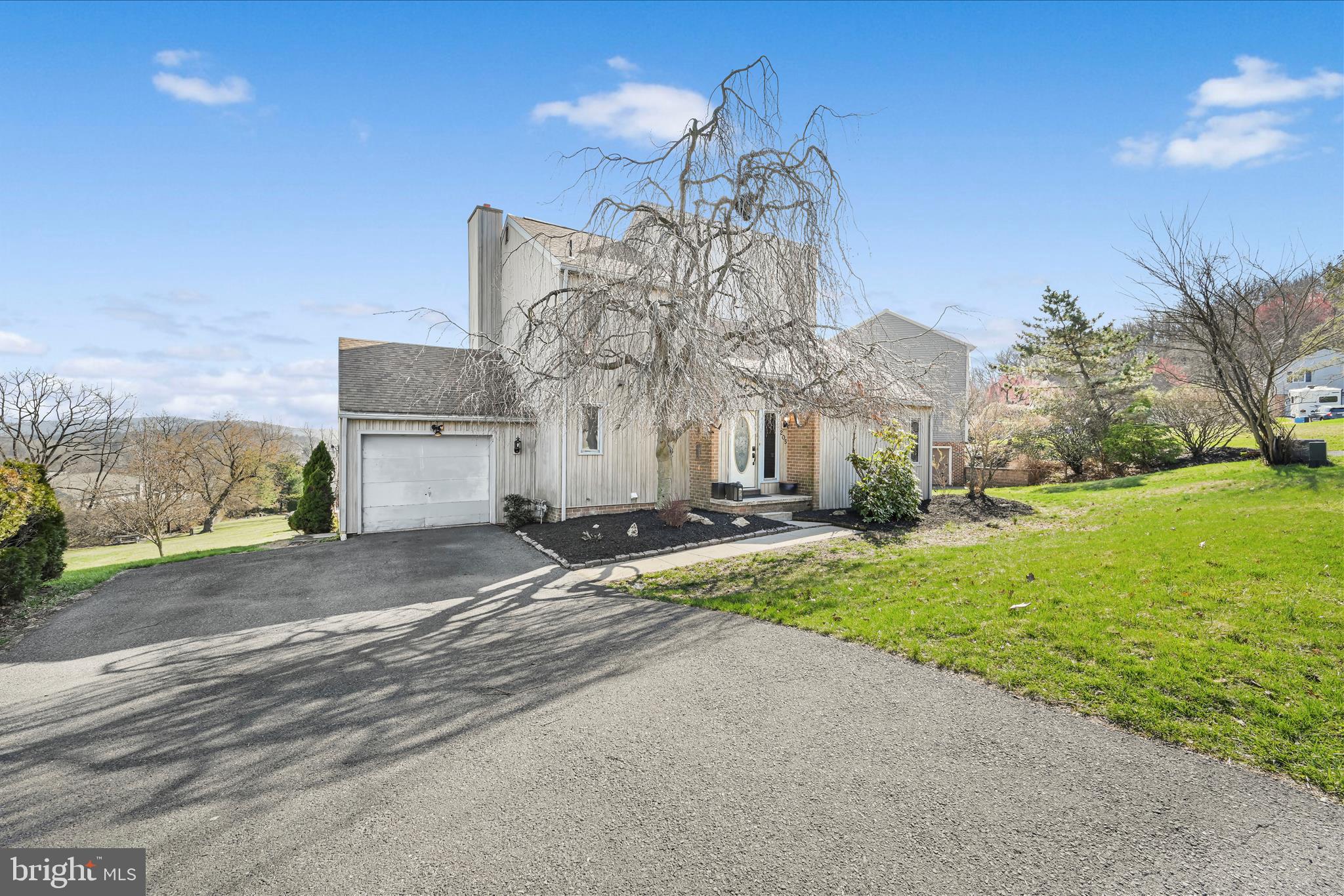 205 Pembroke Drive Reading, PA 19607 - Photo 5 of 40 a view of a street with a building in the background