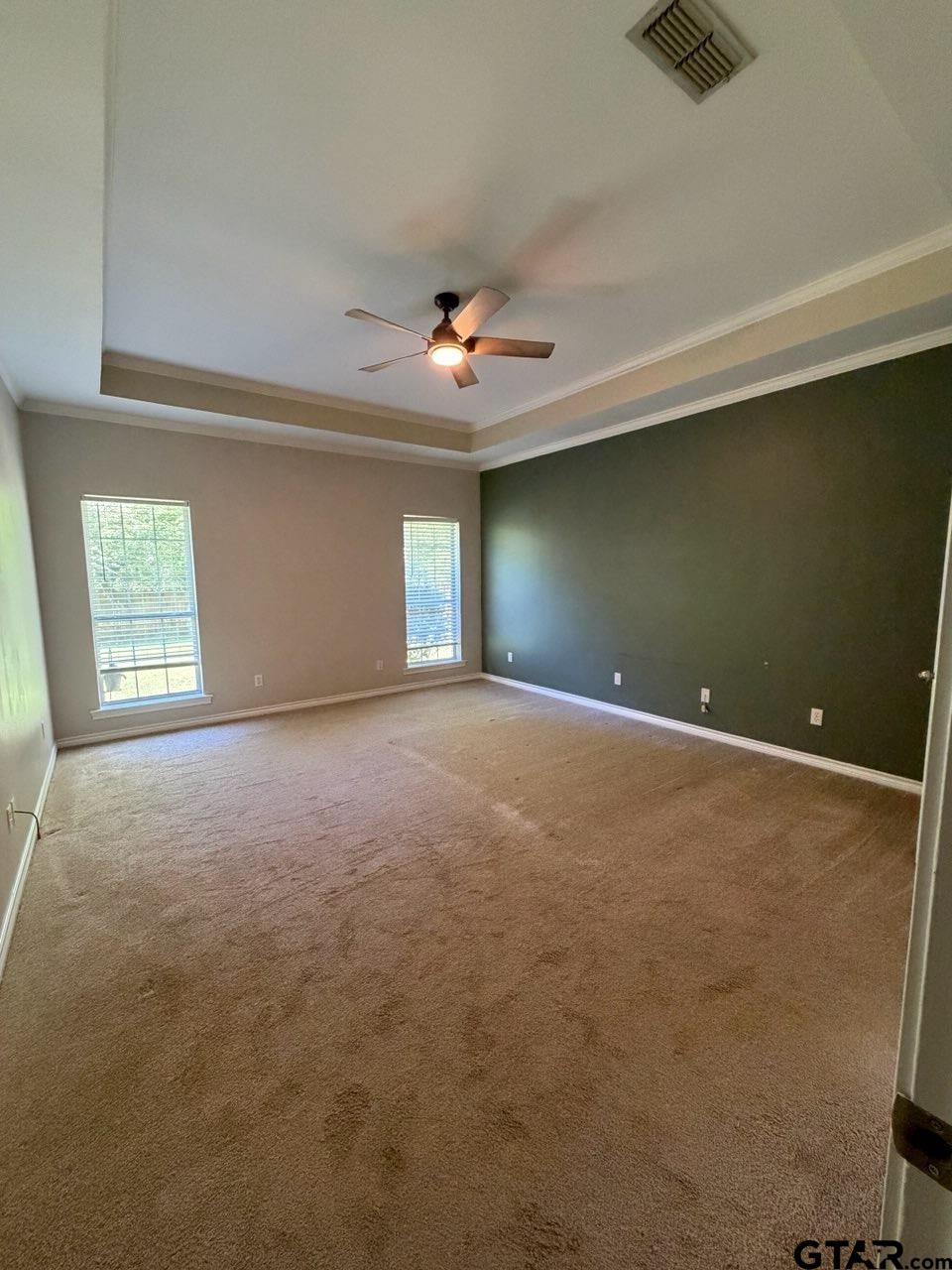 3204 Pebblebrook Circle Tyler, TX 75707 - Photo 11 of 18 an empty room with ceiling fan and window