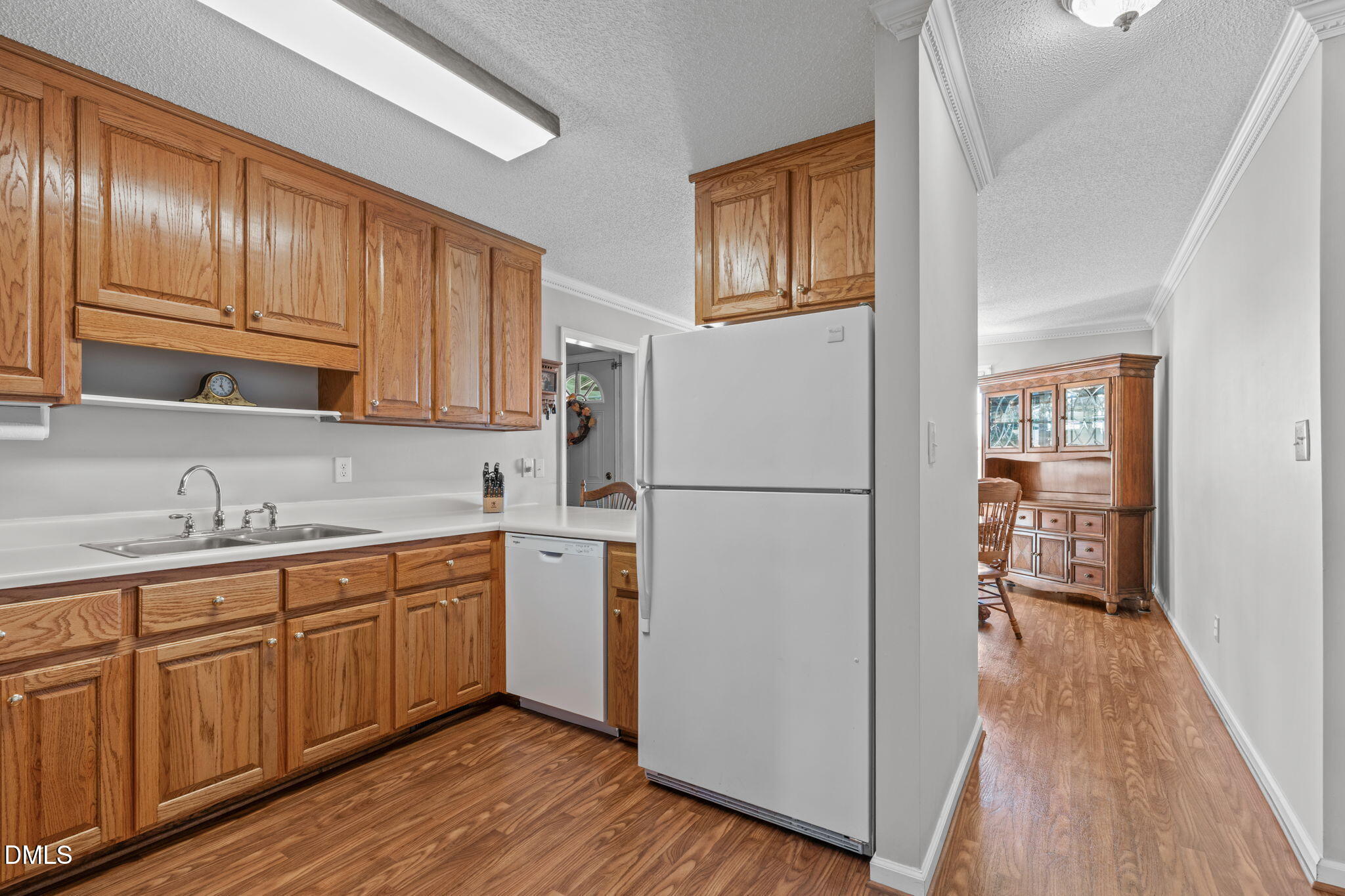 46 Budd Godwin Lane Dunn, NC 28334 - Photo 13 of 33 a kitchen with sink cabinets and wooden floor