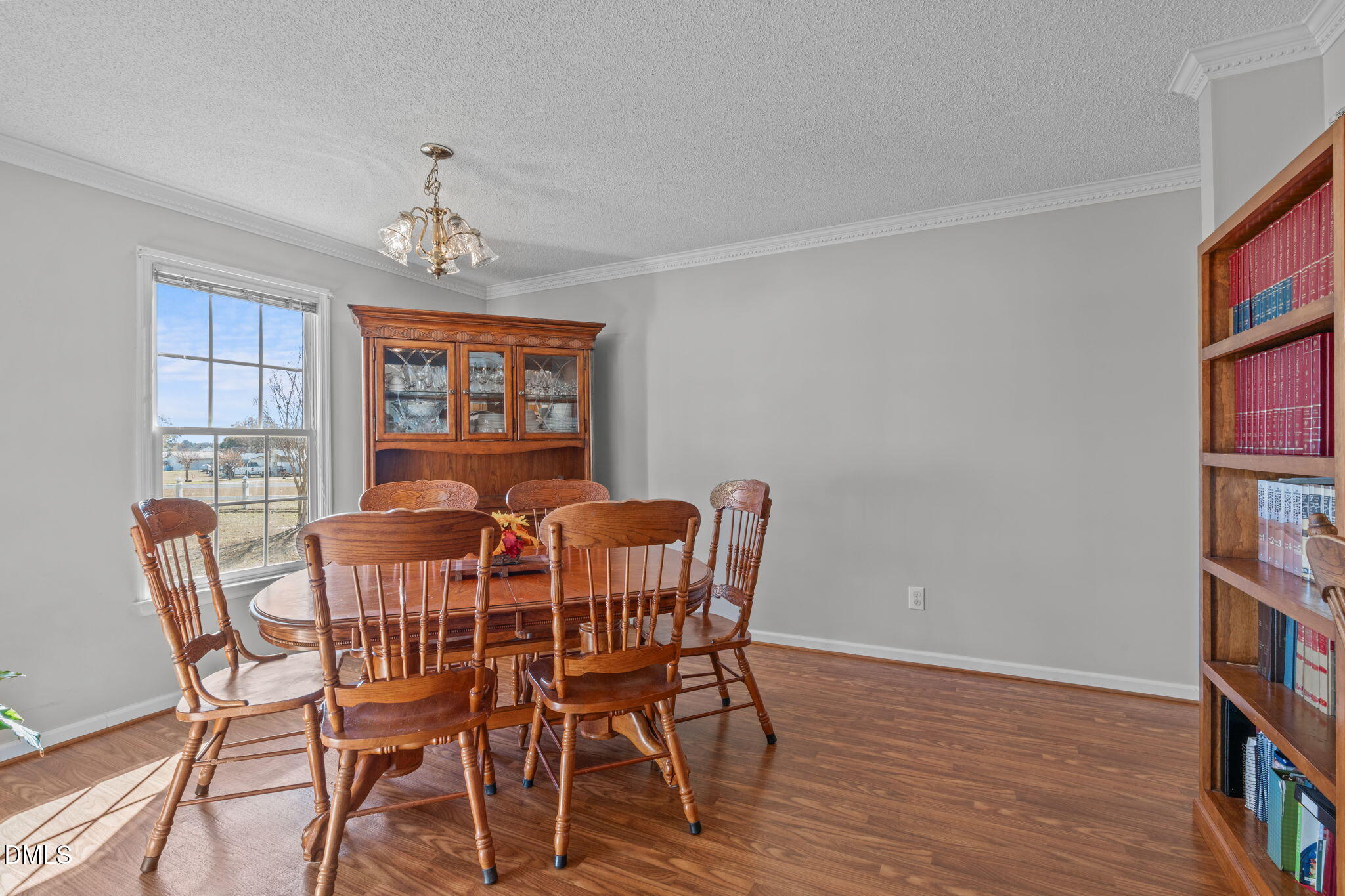 46 Budd Godwin Lane Dunn, NC 28334 - Photo 16 of 33 a view of a dining room with furniture window and wooden floor