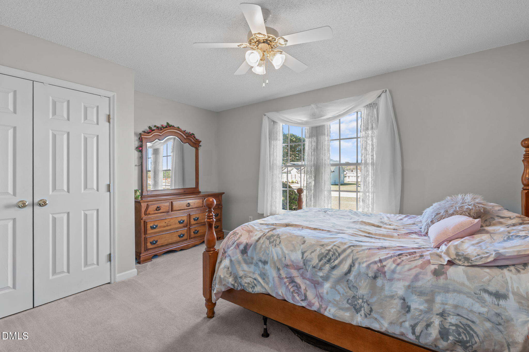 46 Budd Godwin Lane Dunn, NC 28334 - Photo 21 of 33 a bedroom with a bed dresser and a window