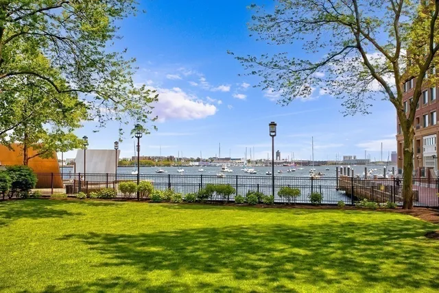 a view of a lake with tall building
