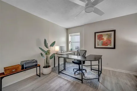 a living room with furniture a window and a table