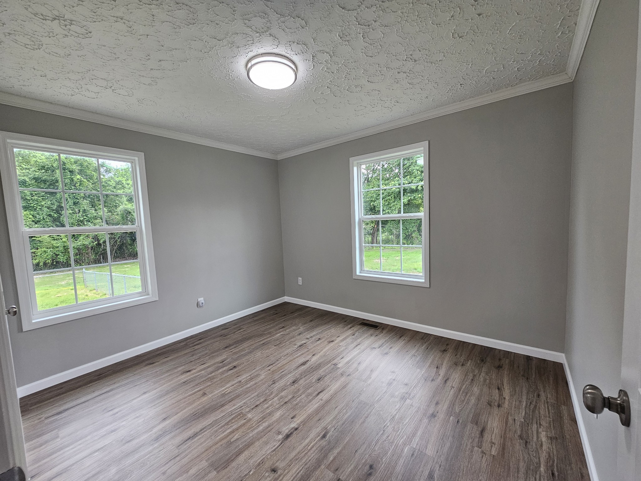 362 Forest Point Road Monteagle, TN 37356 - Photo 42 of 42 a view of an empty room with wooden floor and a window