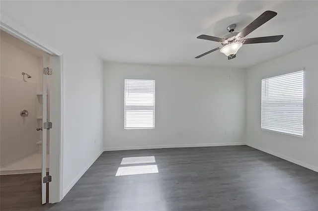 a view of an empty room with a window