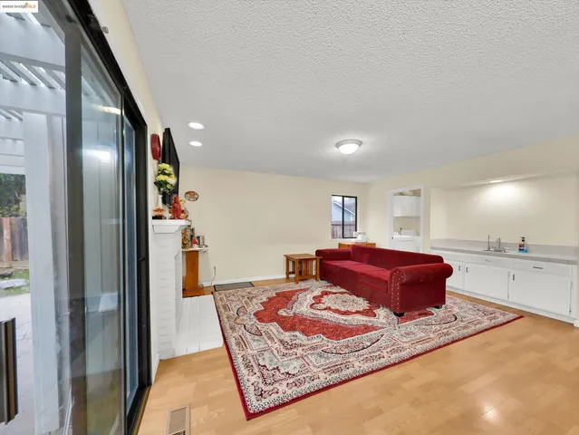 a living room with furniture and a rug
