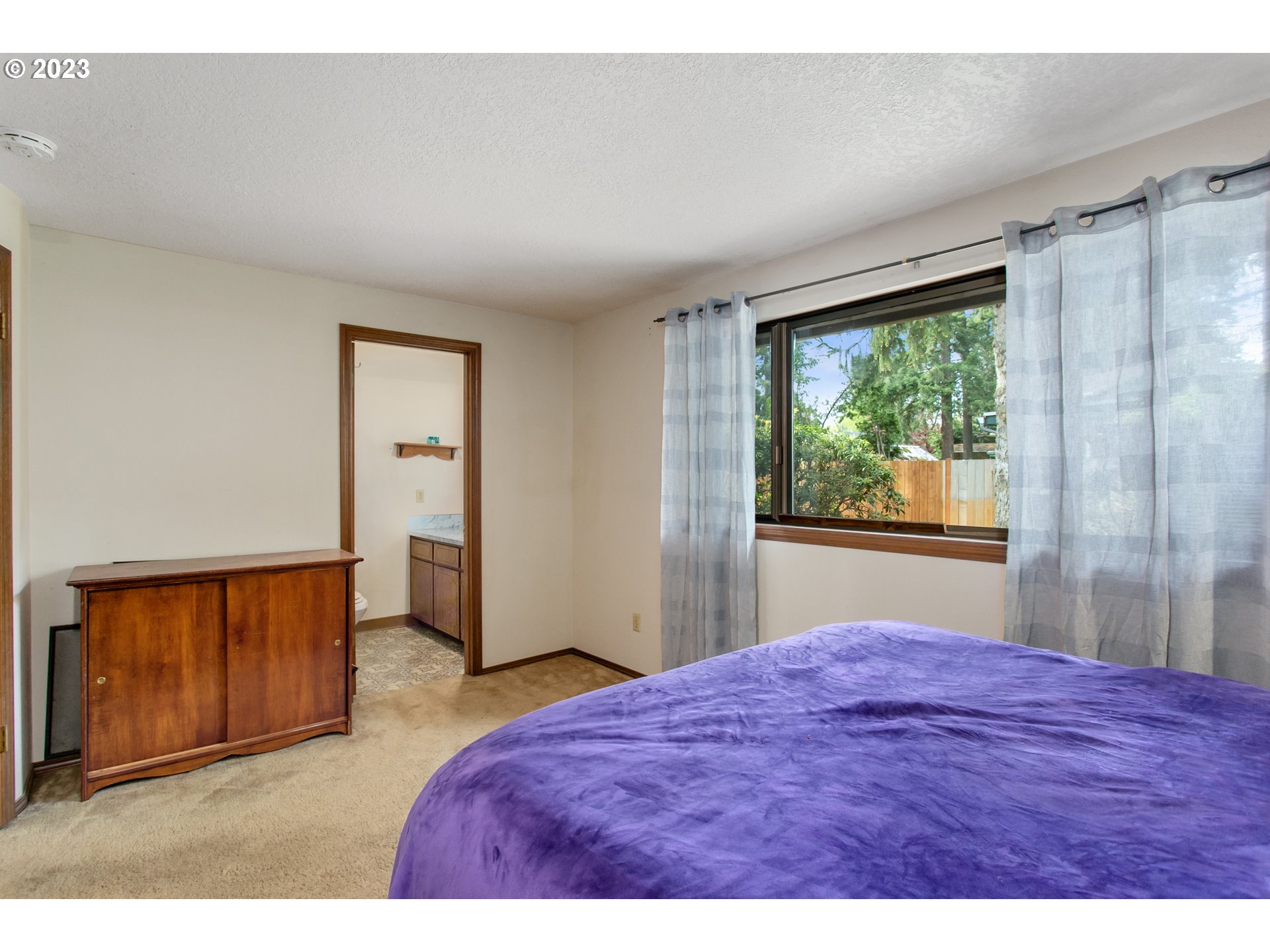 12705 Southeast Kelly Street Portland, OR 97236 - Photo 13 of 33 a bedroom with a bed and a dresser