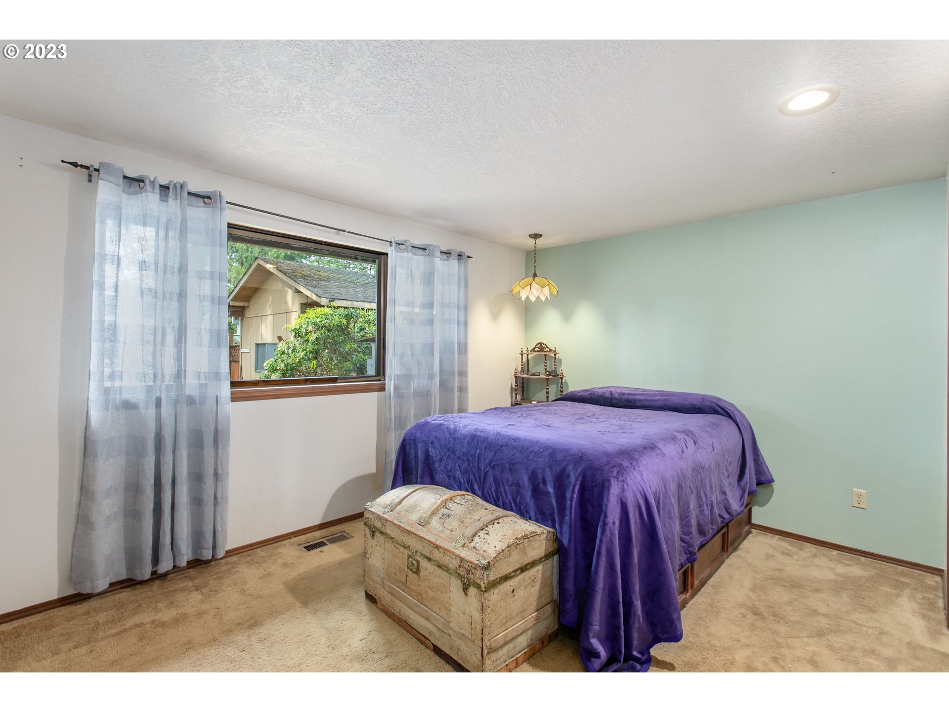 12705 Southeast Kelly Street Portland, OR 97236 - Photo 14 of 33 a bedroom with a bed and a window