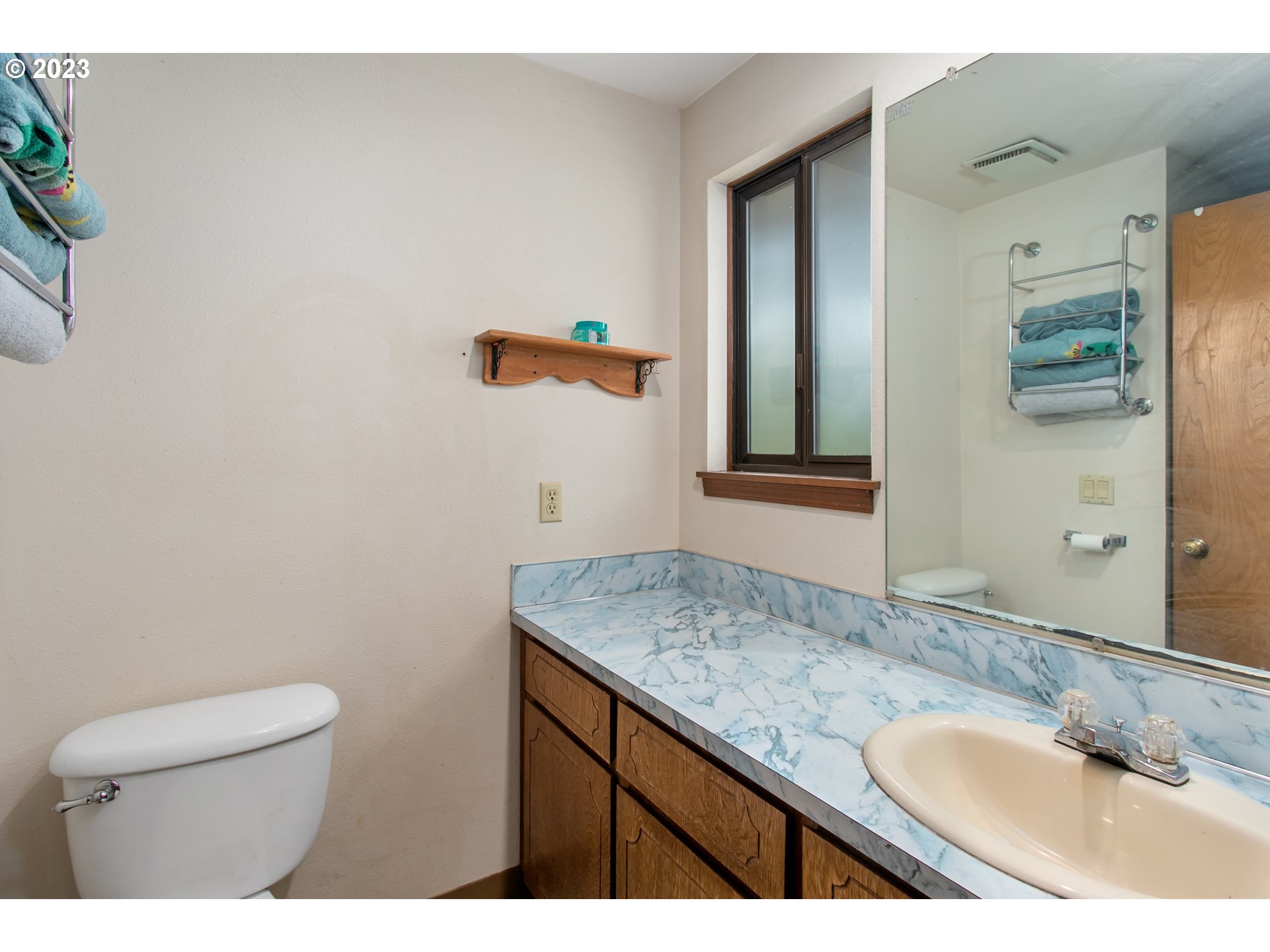 12705 Southeast Kelly Street Portland, OR 97236 - Photo 15 of 33 a bathroom with a granite countertop sink and a mirror