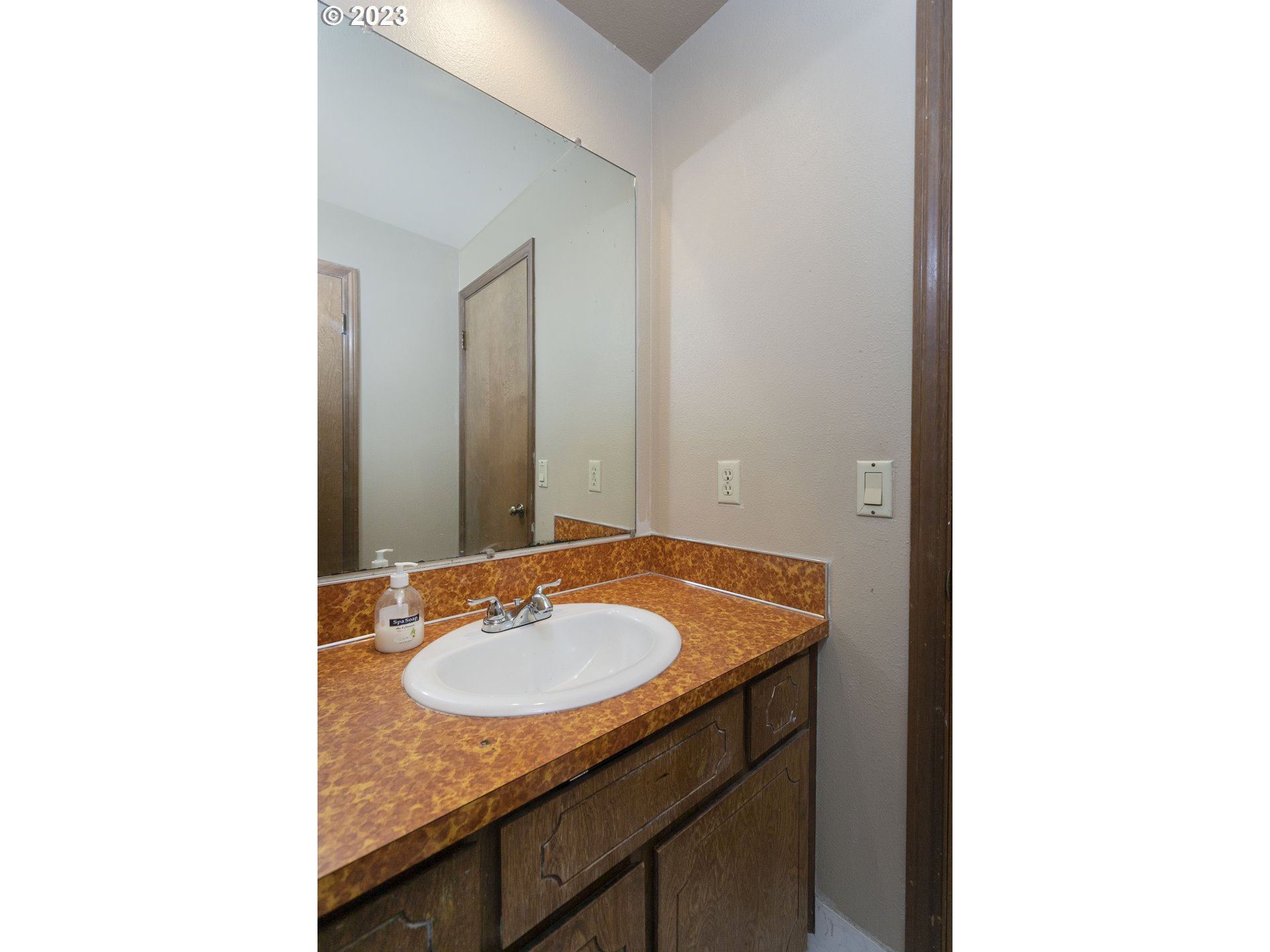 12705 Southeast Kelly Street Portland, OR 97236 - Photo 19 of 33 a bathroom with a sink and a mirror