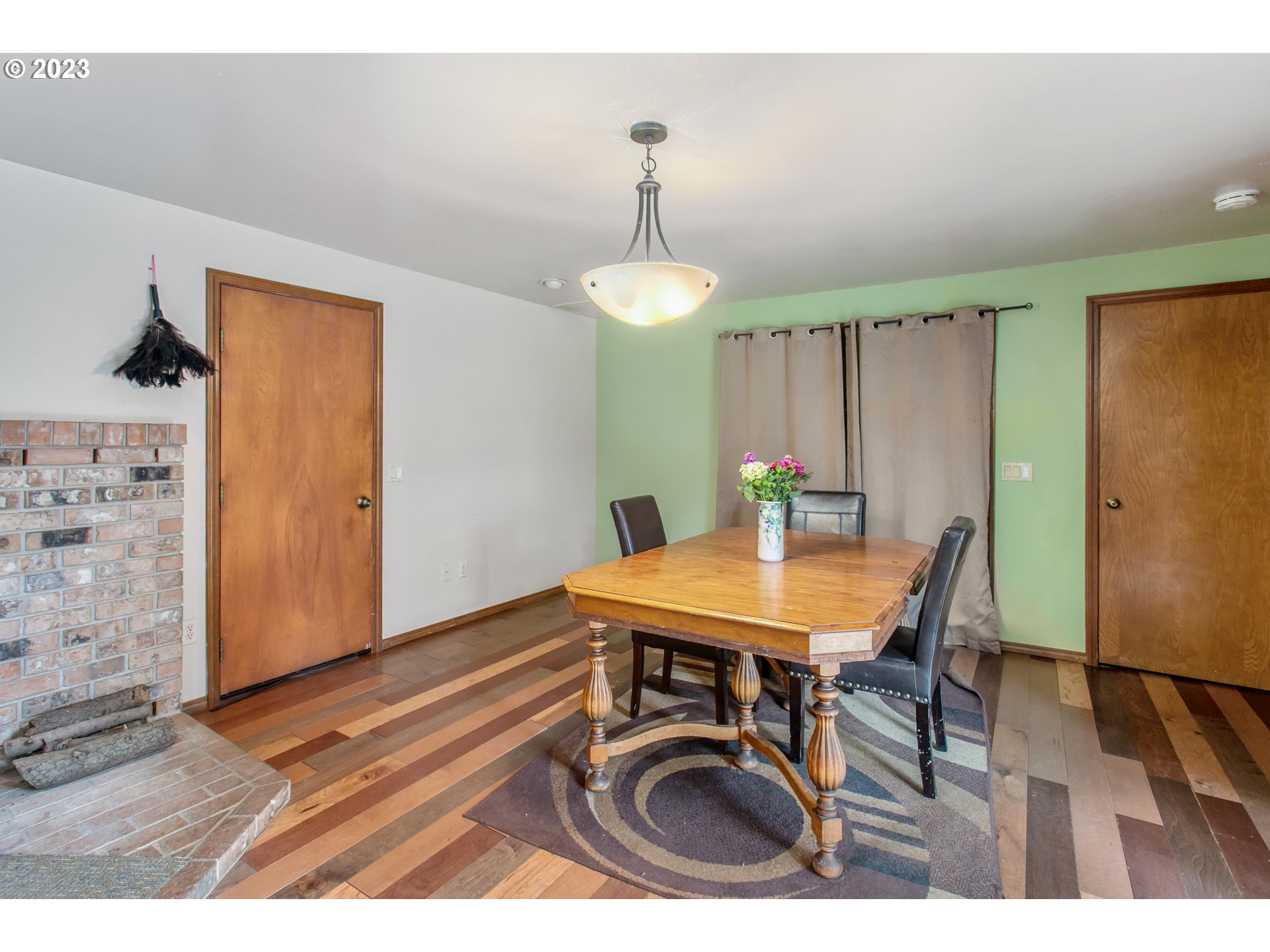 12705 Southeast Kelly Street Portland, OR 97236 - Photo 24 of 33 a view of a dining room with furniture and wooden floor