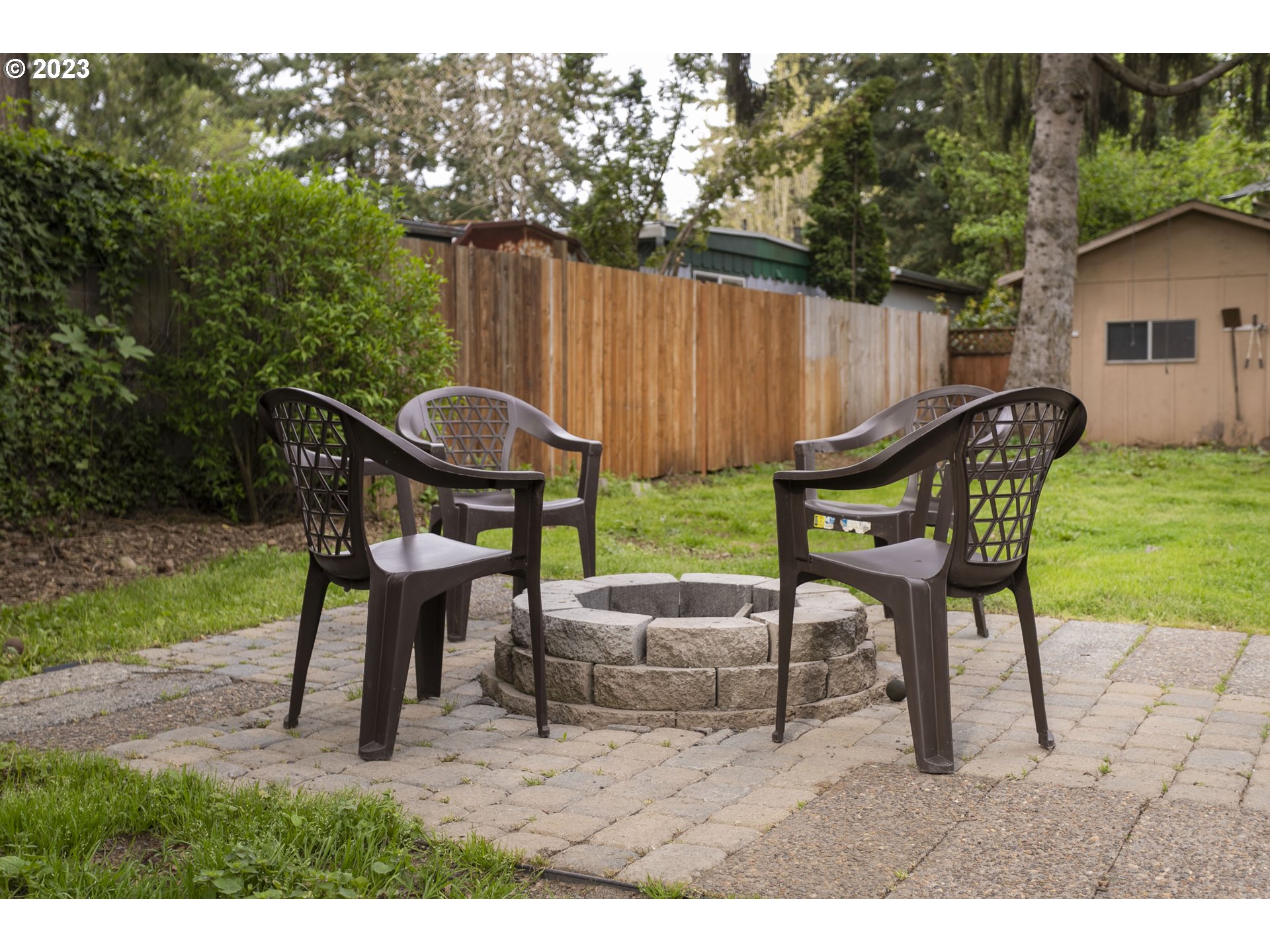 12705 Southeast Kelly Street Portland, OR 97236 - Photo 26 of 33 a view of a chairs and table in the backyard