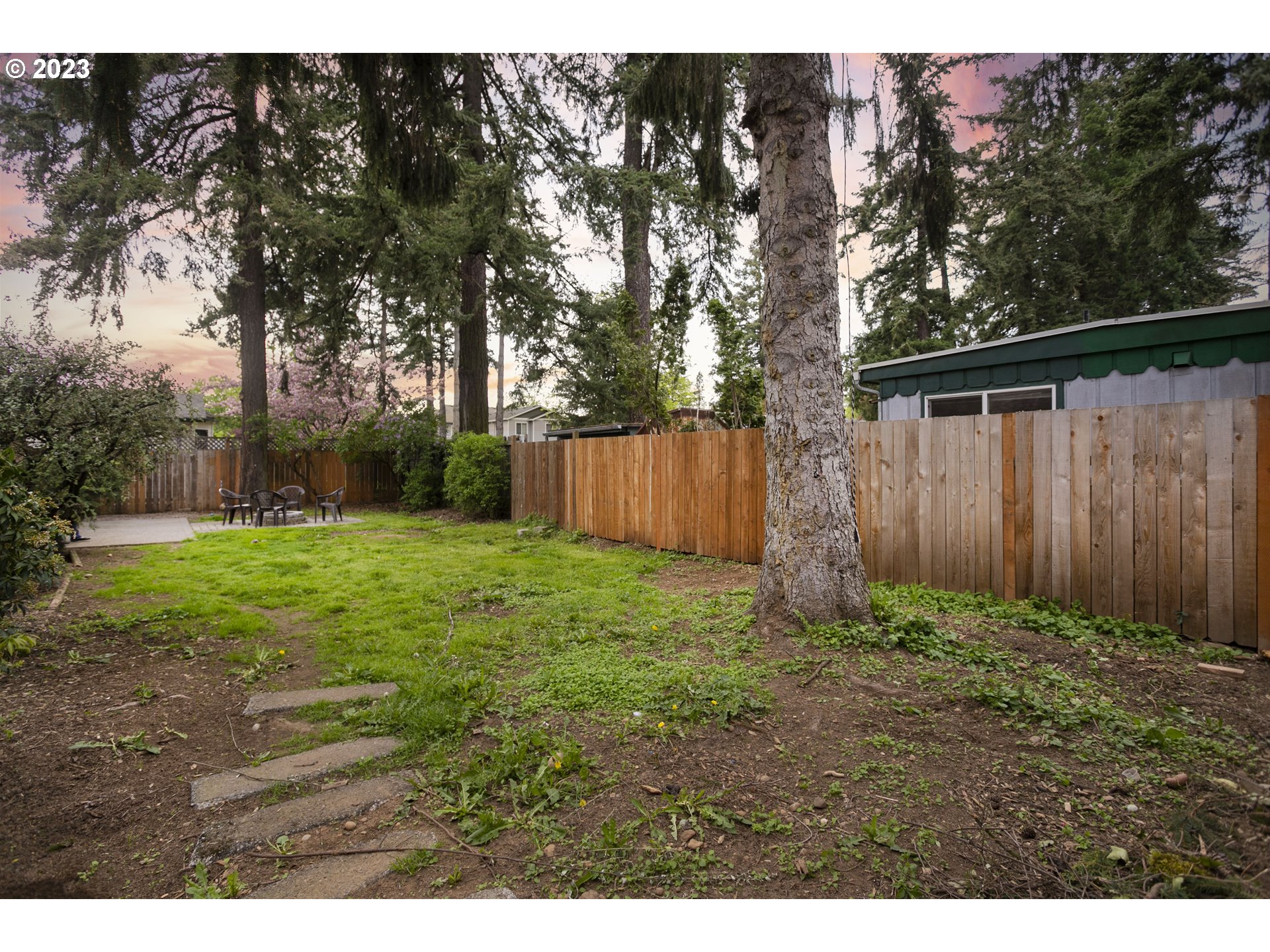 12705 Southeast Kelly Street Portland, OR 97236 - Photo 32 of 33 a backyard of a house with lots of green space