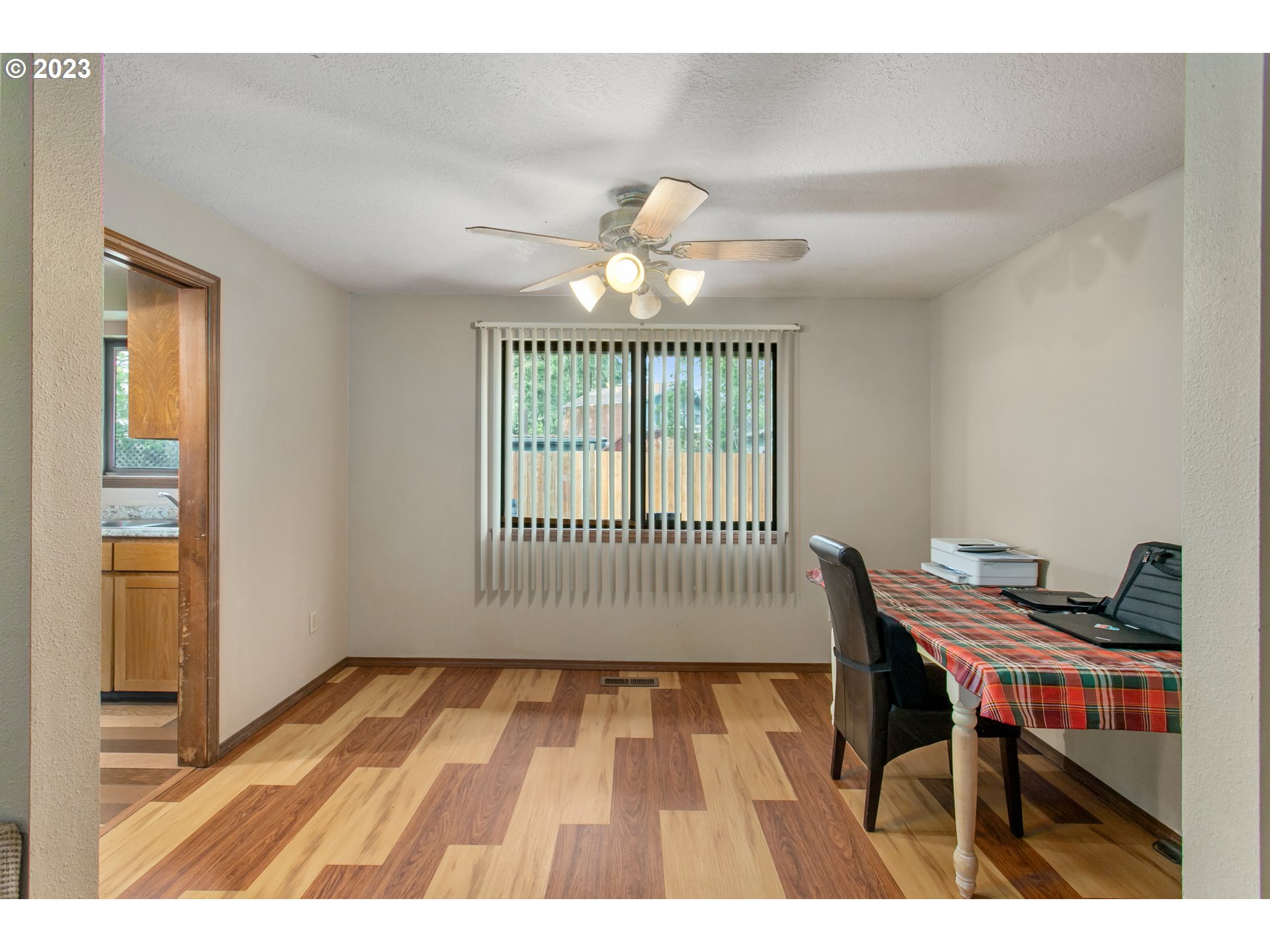 12705 Southeast Kelly Street Portland, OR 97236 - Photo 8 of 33 a workspace with wooden floor and a window