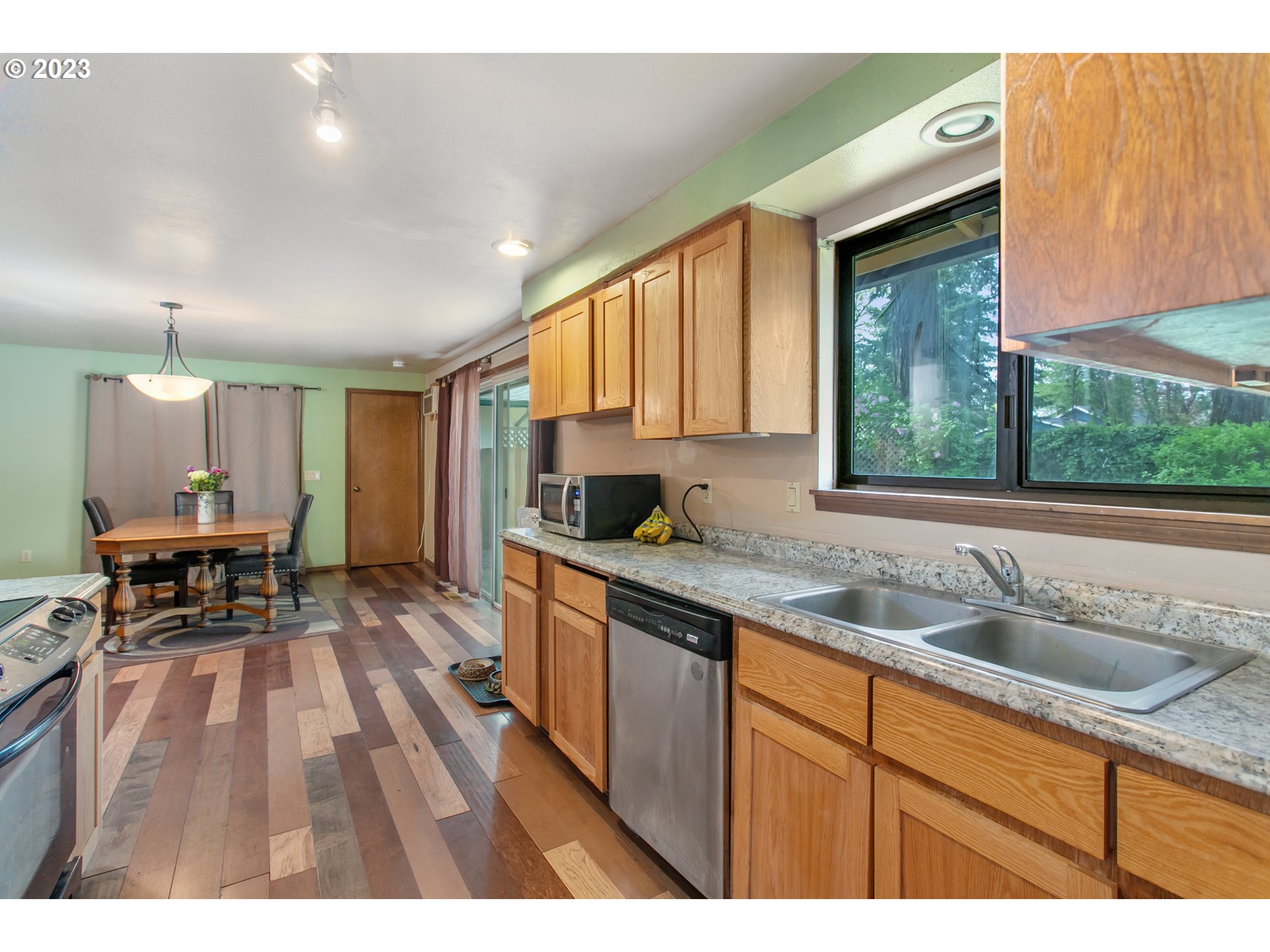 12705 Southeast Kelly Street Portland, OR 97236 - Photo 10 of 33 a kitchen with a sink cabinets and window