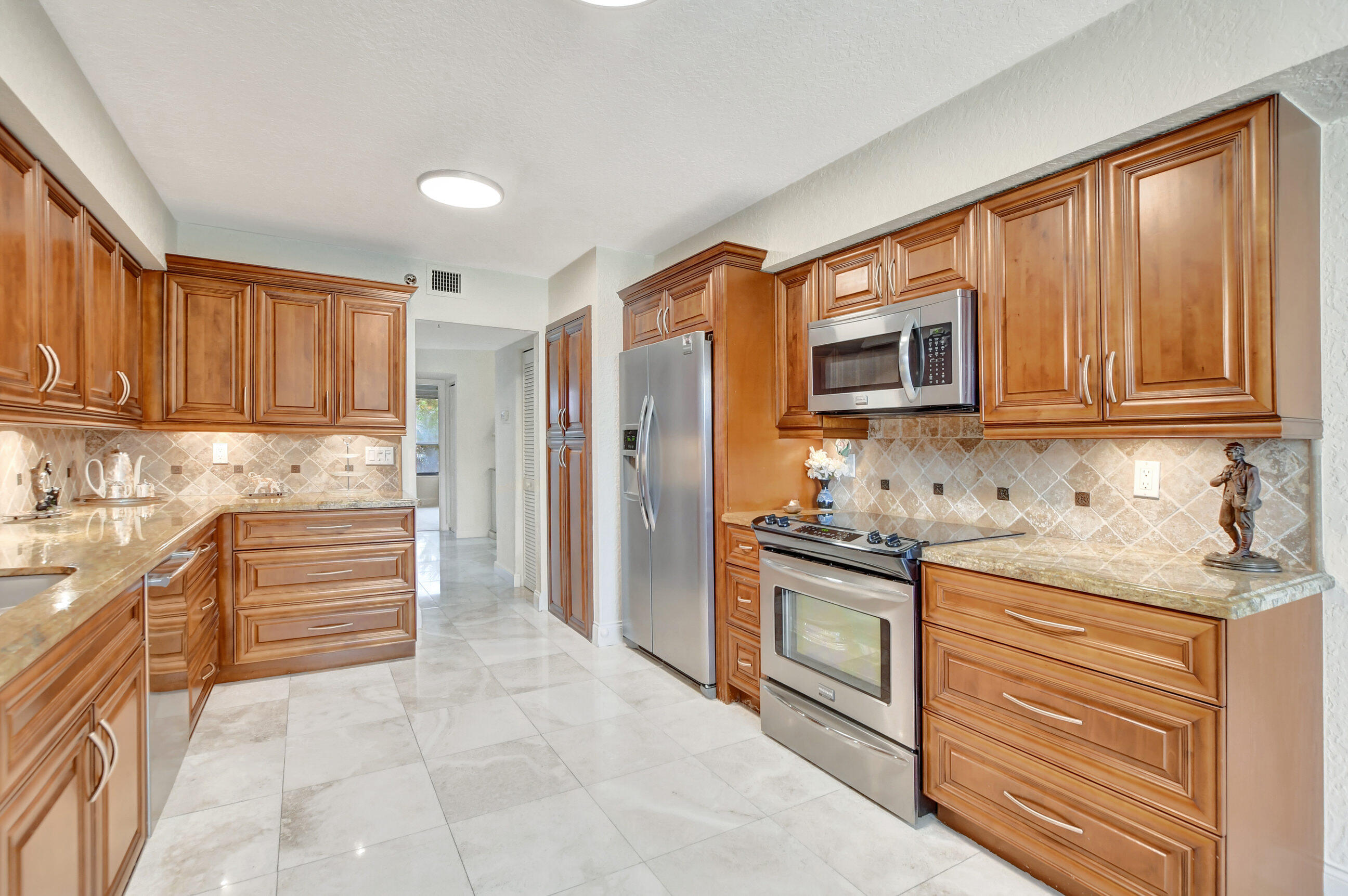 7572 Regency Lake Drive, Unit 201 Boca Raton, FL 33433 - Photo 19 of 50 kitchen