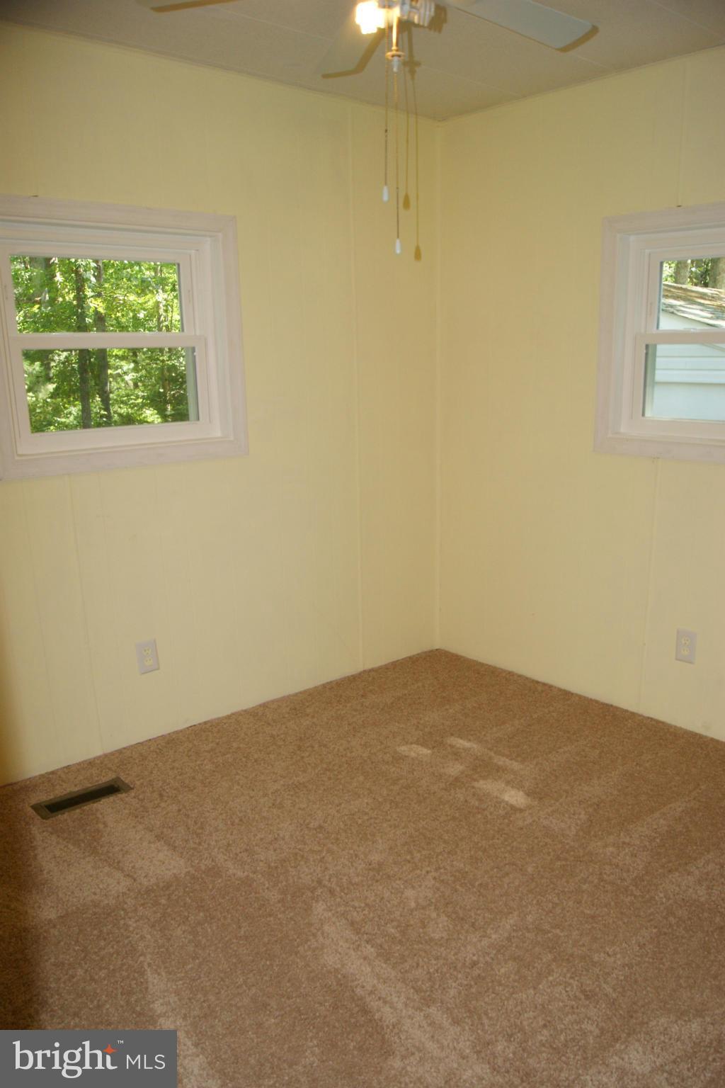 6805 Mackall Road St. Leonard, MD 20685 - Photo 16 of 30 an empty room with a window