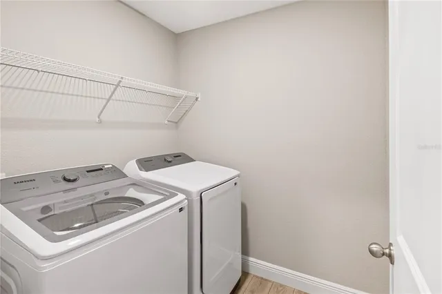 a utility room with dryer and washer