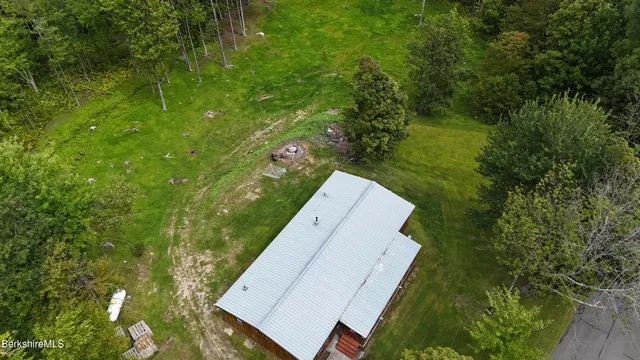 a view of outdoor space with green field and trees