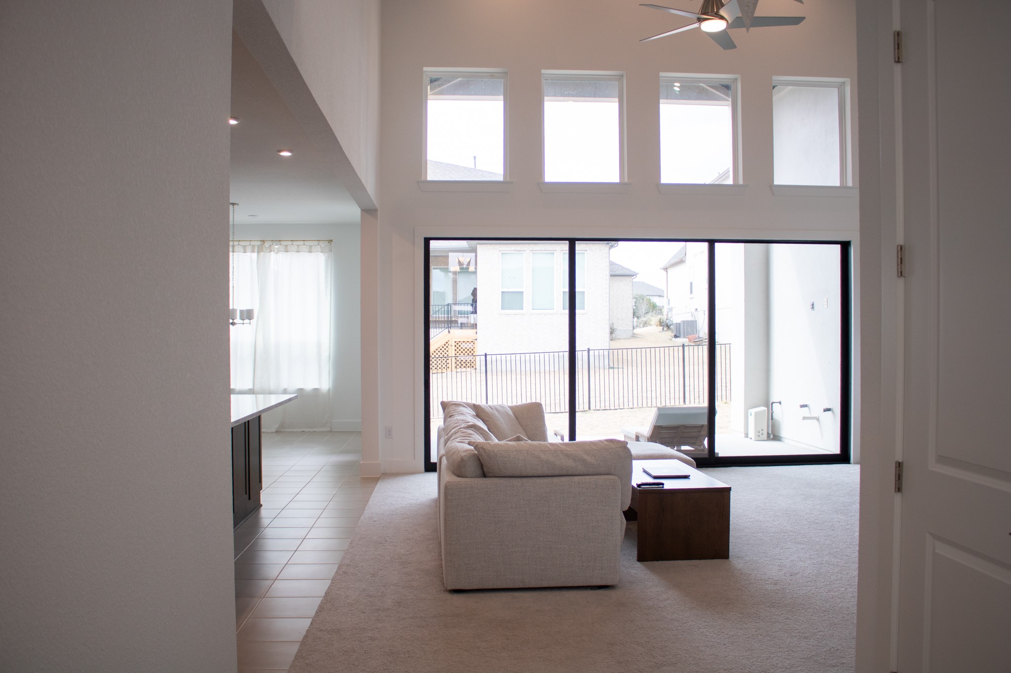 1709 Novara Trail Leander, TX 78641 - Photo 13 of 40 Living room featuring a high ceiling, ceiling fan, light tile patterned flooring, and recessed lighting