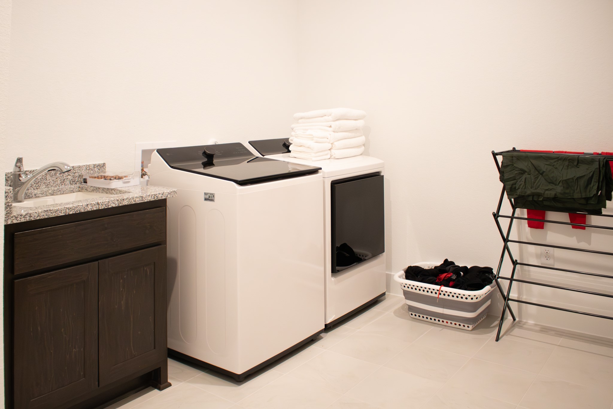 1709 Novara Trail Leander, TX 78641 - Photo 21 of 40 Laundry room featuring a sink and separate washer and dryer