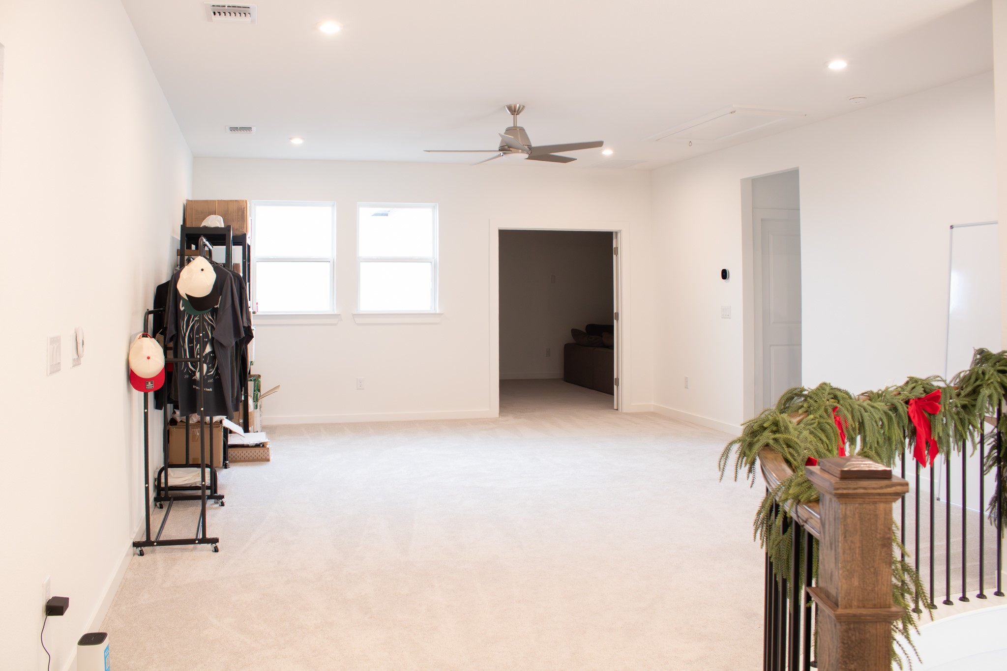 1709 Novara Trail Leander, TX 78641 - Photo 34 of 40 Living area featuring a ceiling fan, light colored carpet, and recessed lighting