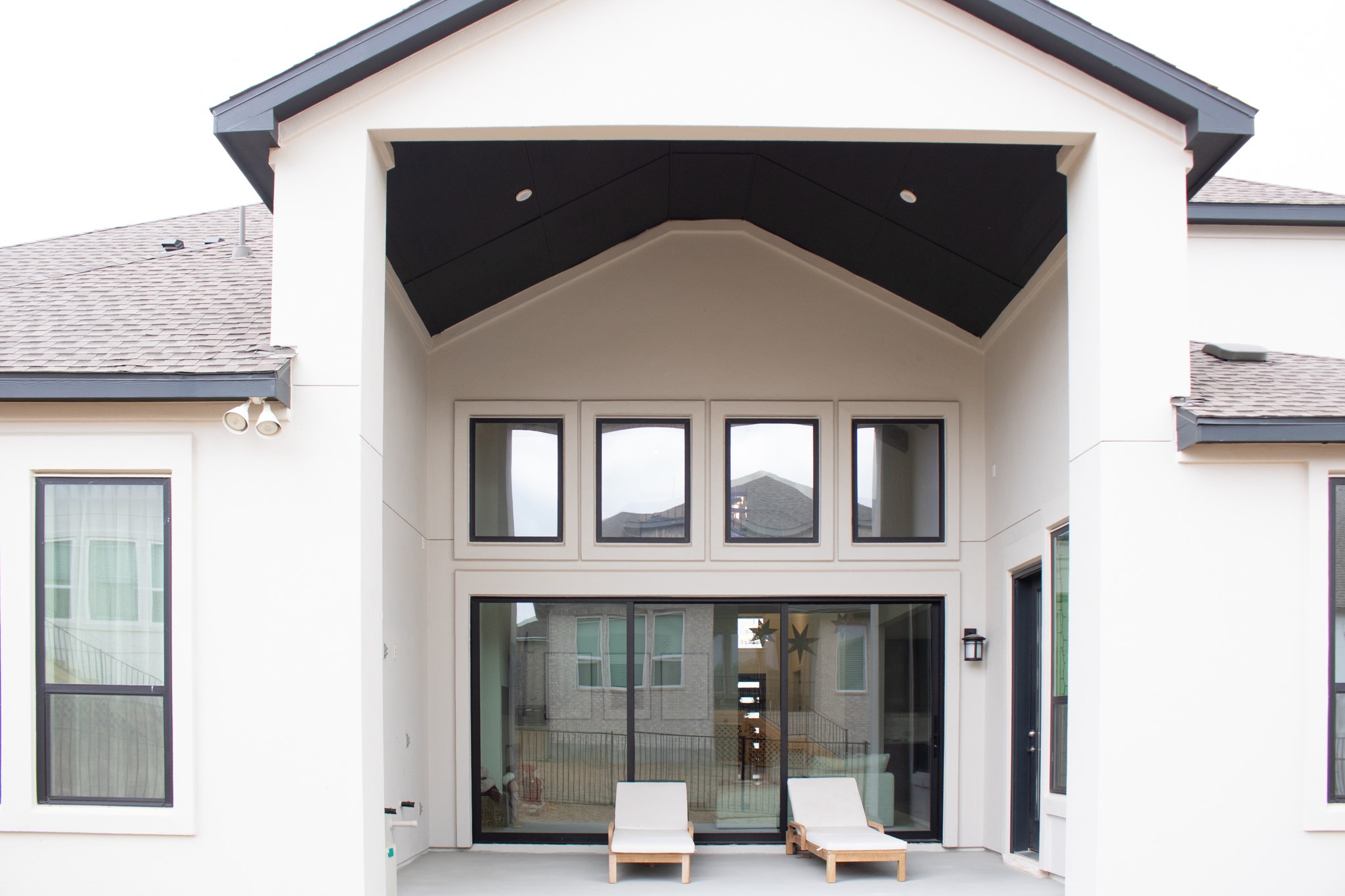 1709 Novara Trail Leander, TX 78641 - Photo 39 of 40 Rear view of property with a shingled roof, a patio area, and stucco siding