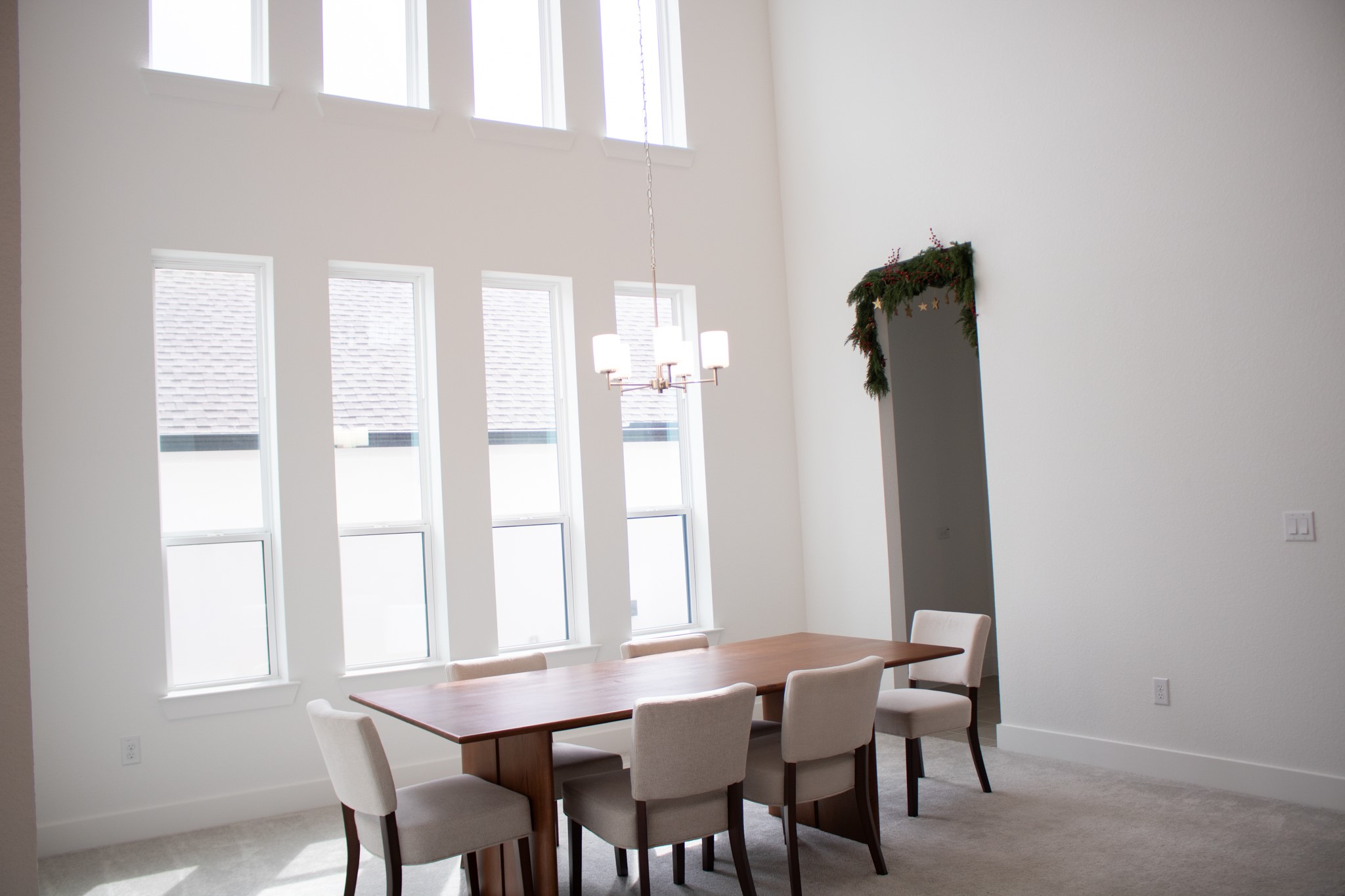 1709 Novara Trail Leander, TX 78641 - Photo 10 of 40 Dining room featuring a chandelier, a high ceiling, and light colored carpet
