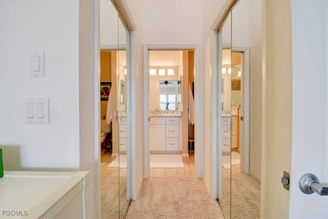 a bathroom with a sink toilet and a window