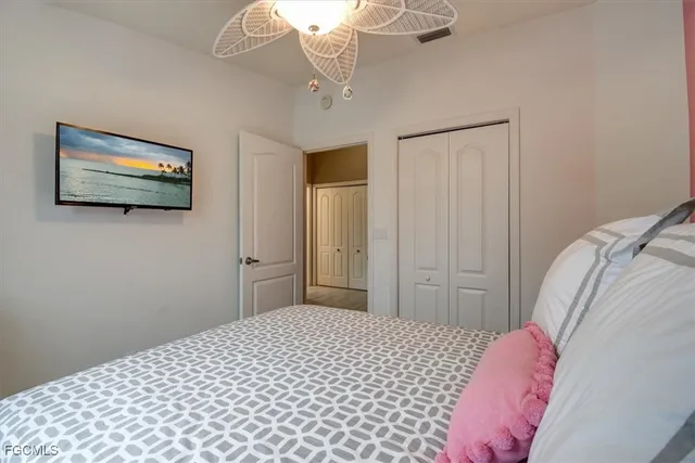 a view of a kitchen with a refrigerator and a stove top oven