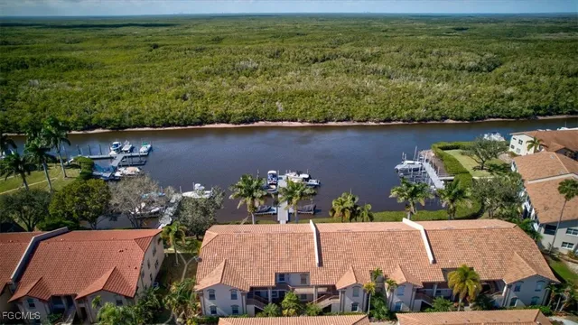 an aerial view of house with yard swimming pool and outdoor seating