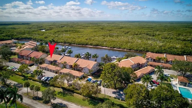 an aerial view of a house with outdoor space