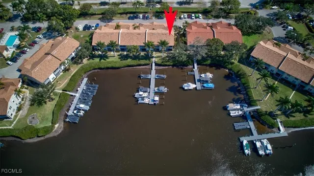 a view of a house with swimming pool and sitting area