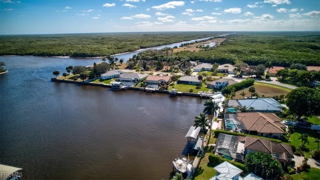 an aerial view of a house with a lake view