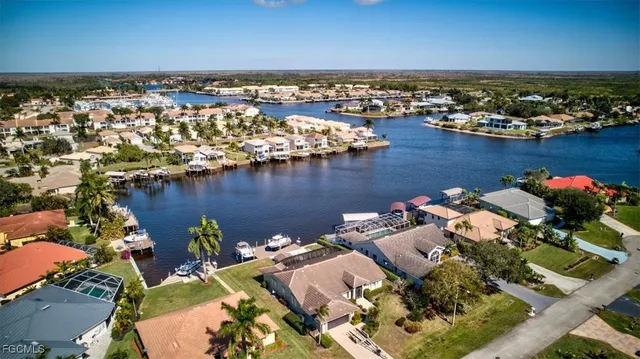 an aerial view of a house with swimming pool