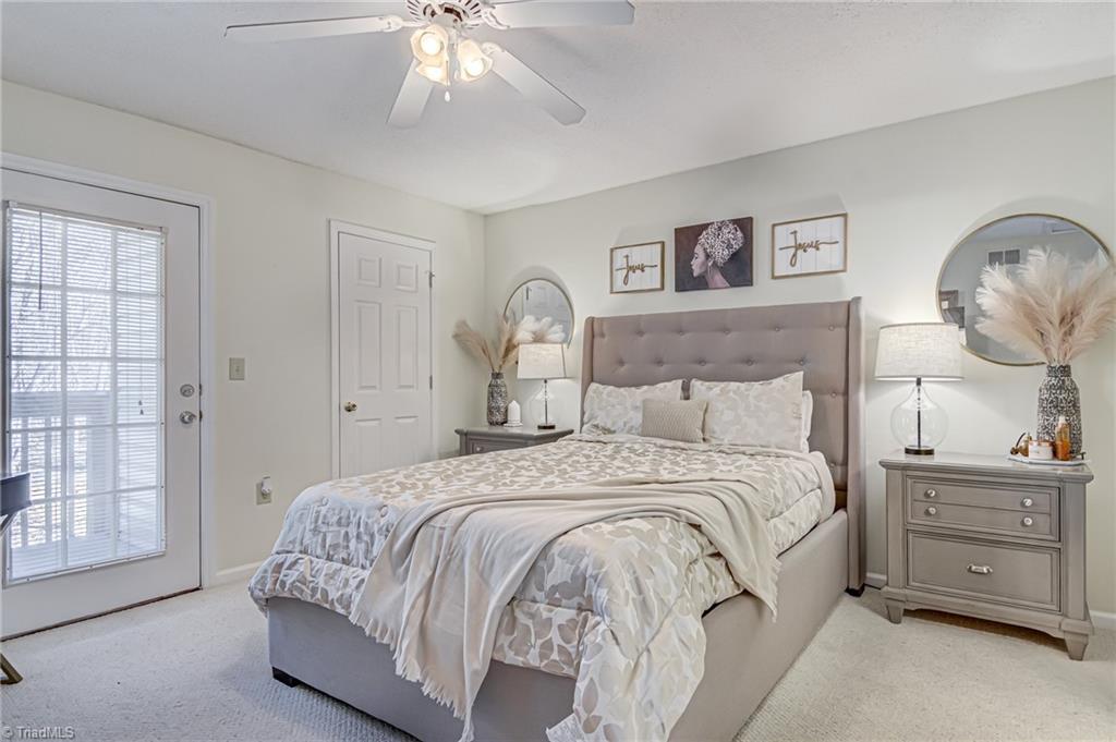 2640 Ingleside Drive, Unit 2D High Point, NC 27265 - Photo 12 of 27 Large primary bedroom features ceiling fan, walk-in closet, and en suite bathroom!